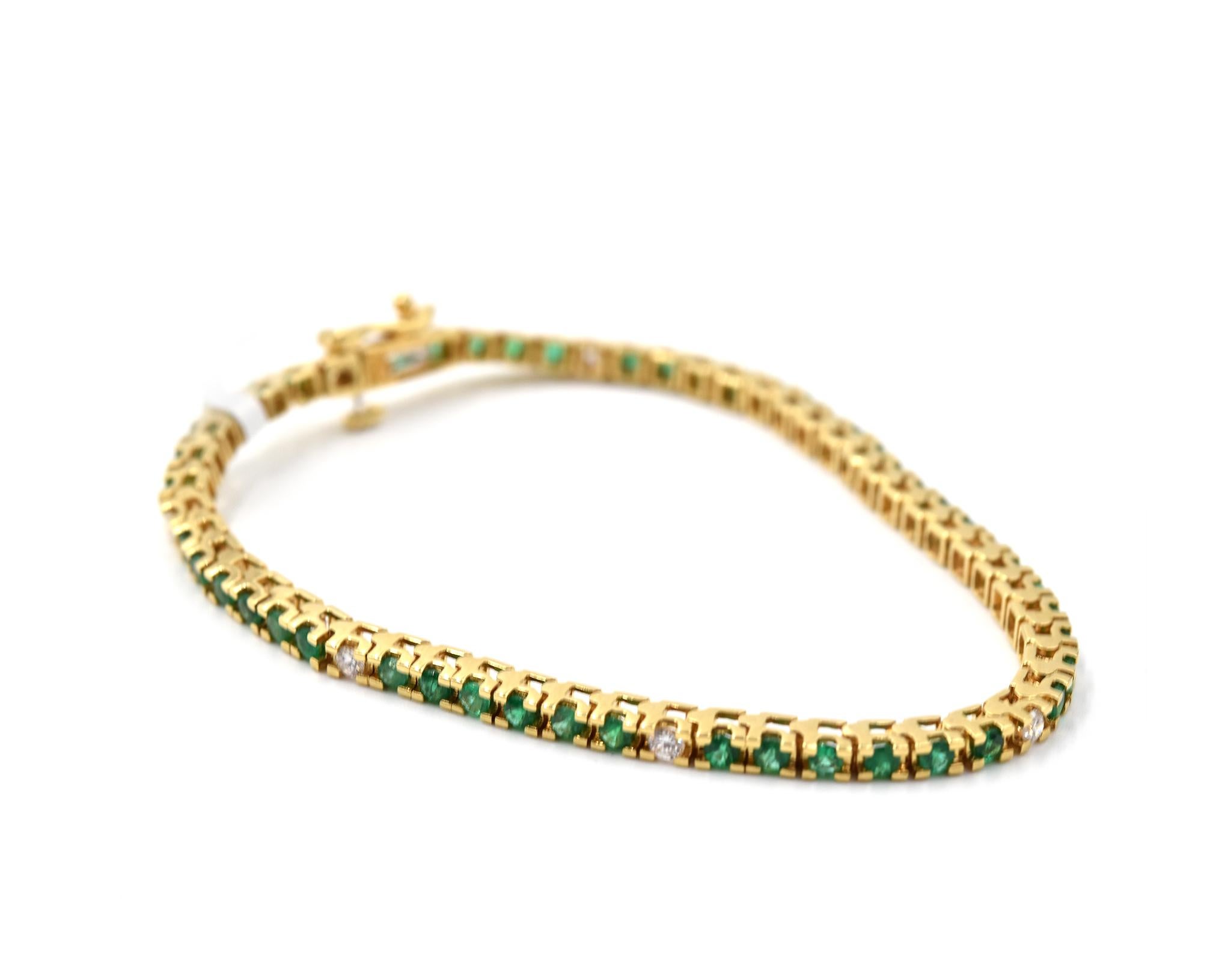 emerald tennis bracelet yellow gold