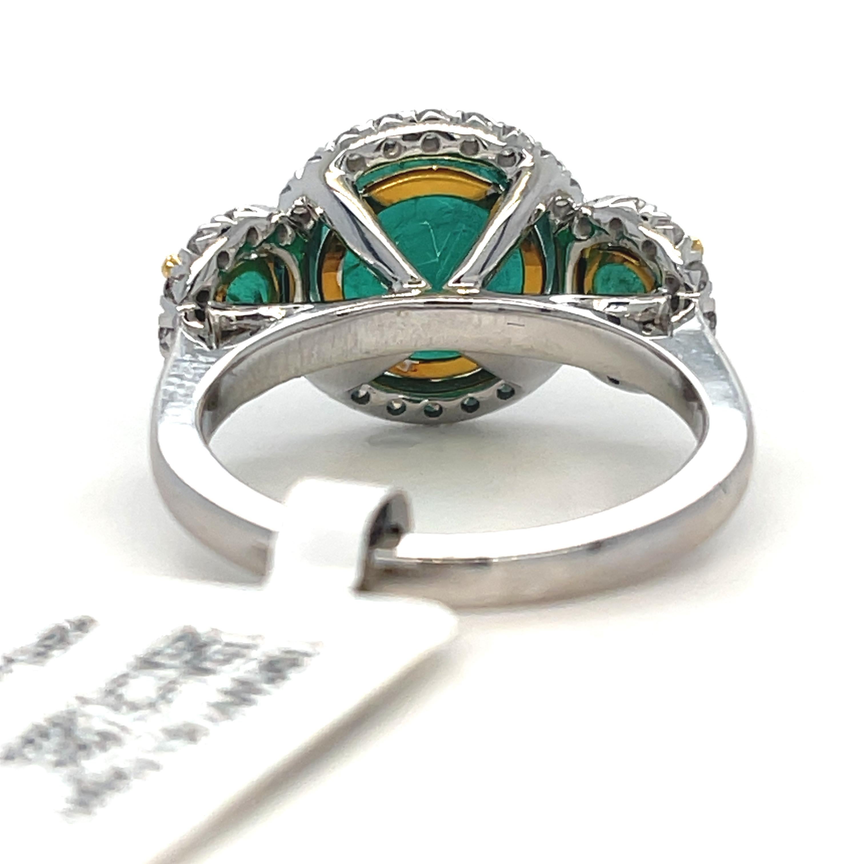 Emerald and Diamond 3 stone halo Ring in 18K Yellow and White Gold  In New Condition For Sale In New York, NY