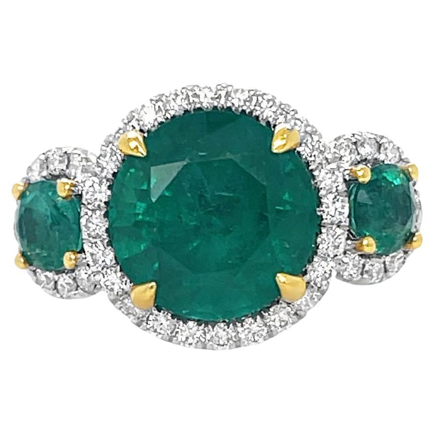 Emerald and Diamond 3 stone halo Ring in 18K Yellow and White Gold  For Sale