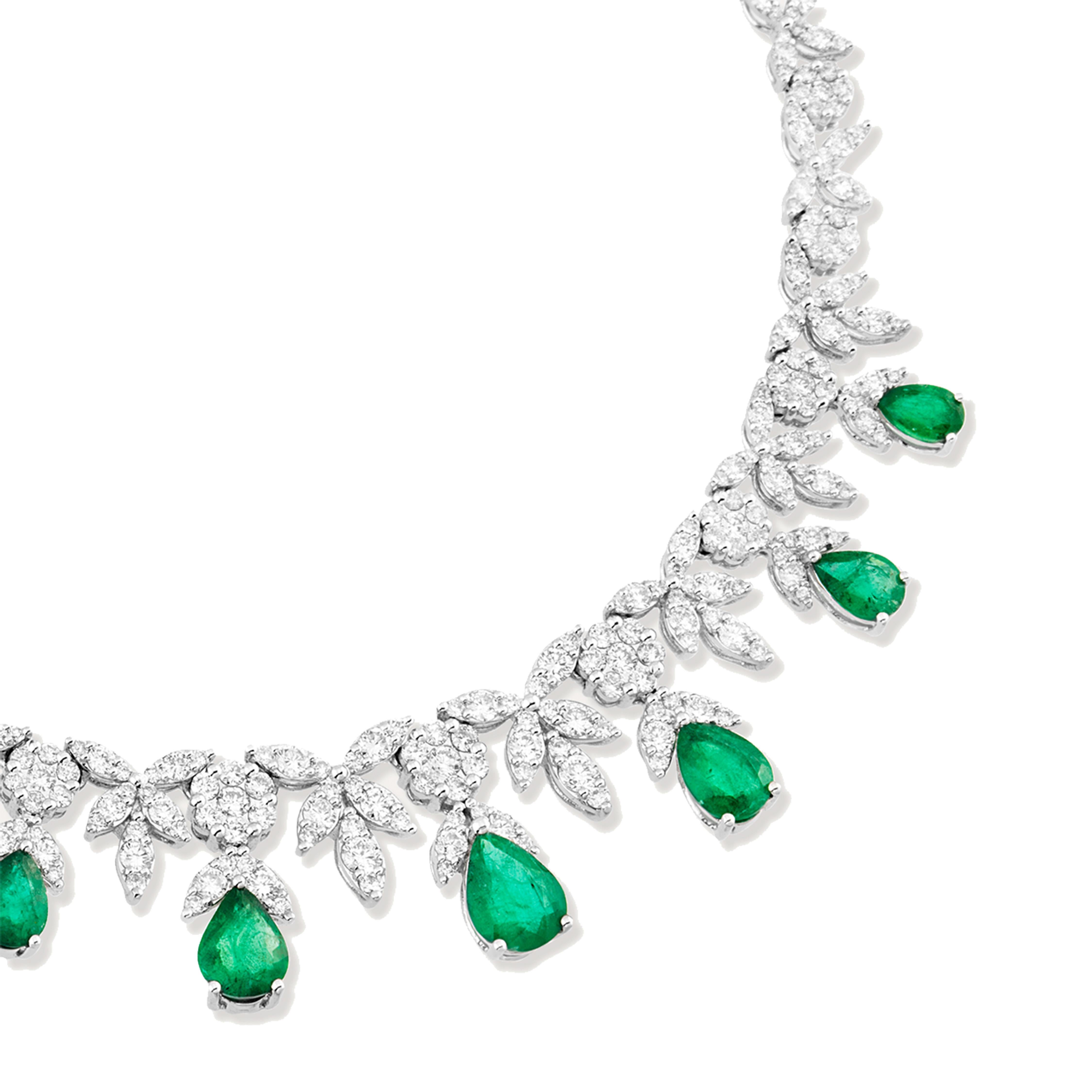 Are you looking for a unique and stunning piece of jewelry that will make you stand out from the crowd? Then look no further than this gorgeous emerald and diamond necklace! 
This necklace features 9.95 carats of beautiful, vivid green emeralds,