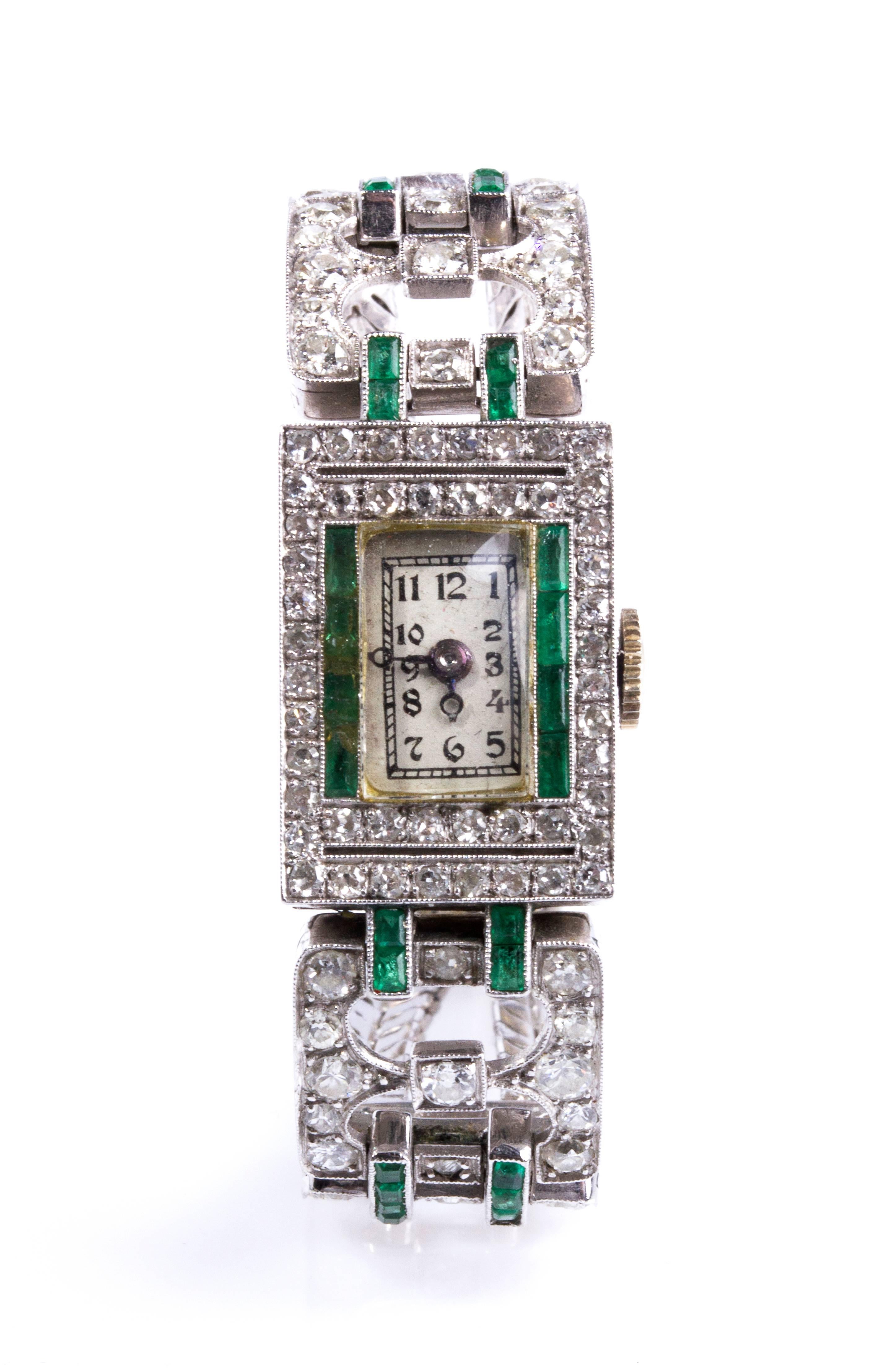 Geometric motifs embellished with emerald and 100 round, huit-huit and brilliant cut diamond weighing 3.00 ct. 