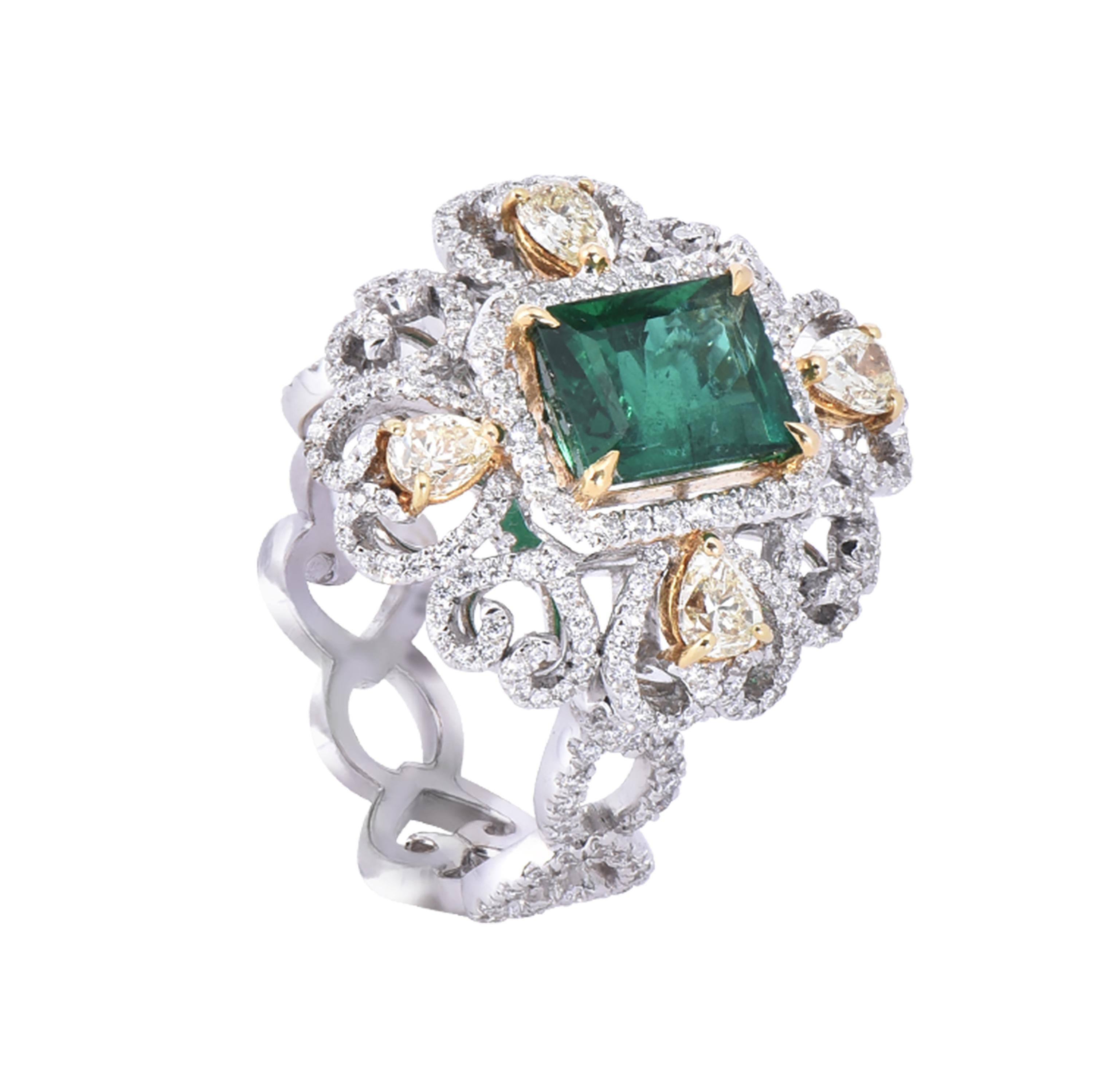 An elegant 18 karat white & yellow gold emerald ring from the Veronese collection of Laviere. The ring is set with a GRS certified 2.30 carats emerald-cut emerald, 0.66 carats pear shape fancy light yellow diamonds and 0.93 carats white brilliant