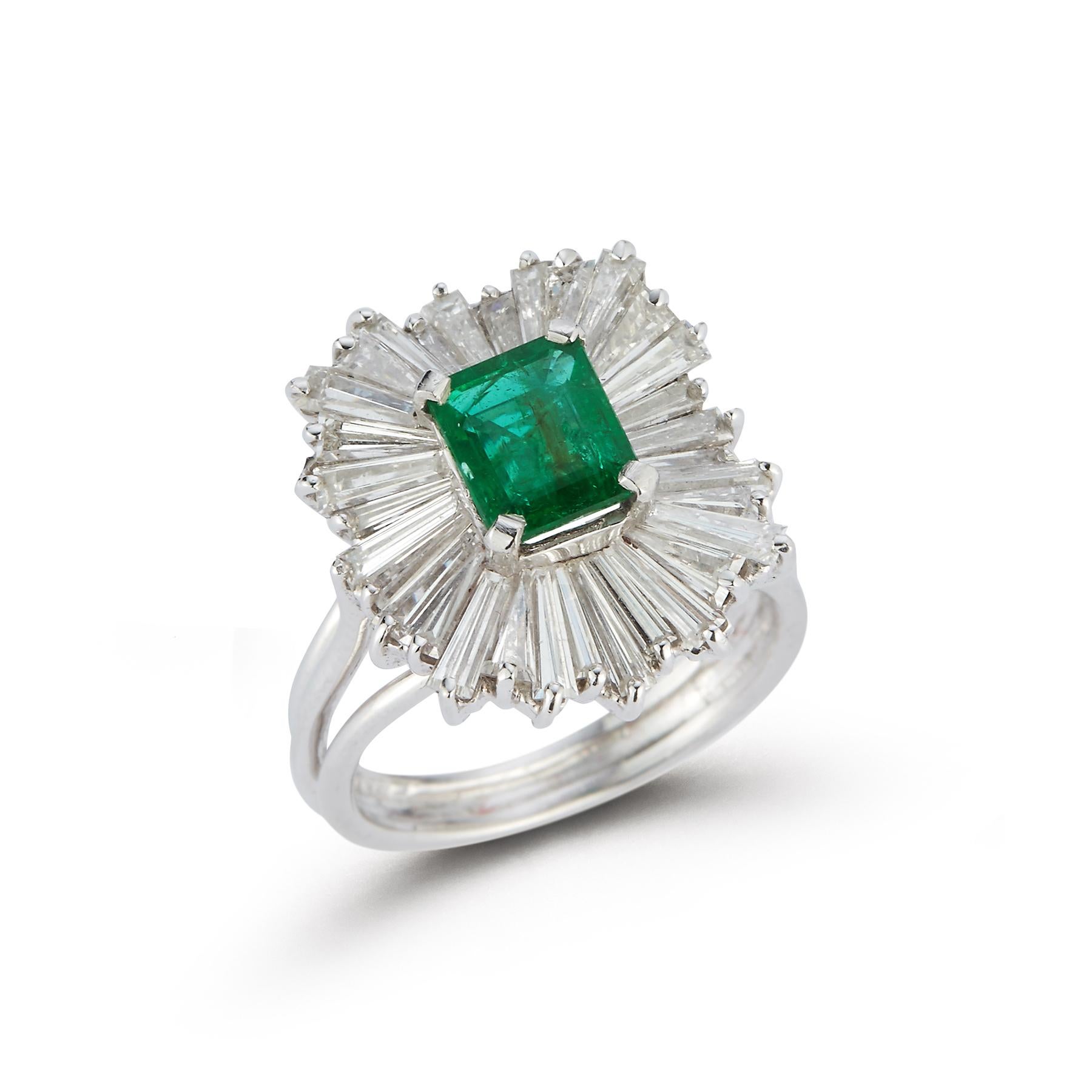 Emerald and Diamond Ballerina Cocktail Ring

Platinum Ring with Center Emerald approximately 1.30 Carats Surrounded by an Array of Baguette Cut Diamonds approximately 2.54 Carats

Ring Size 5.5

Resizable Free of Charge
