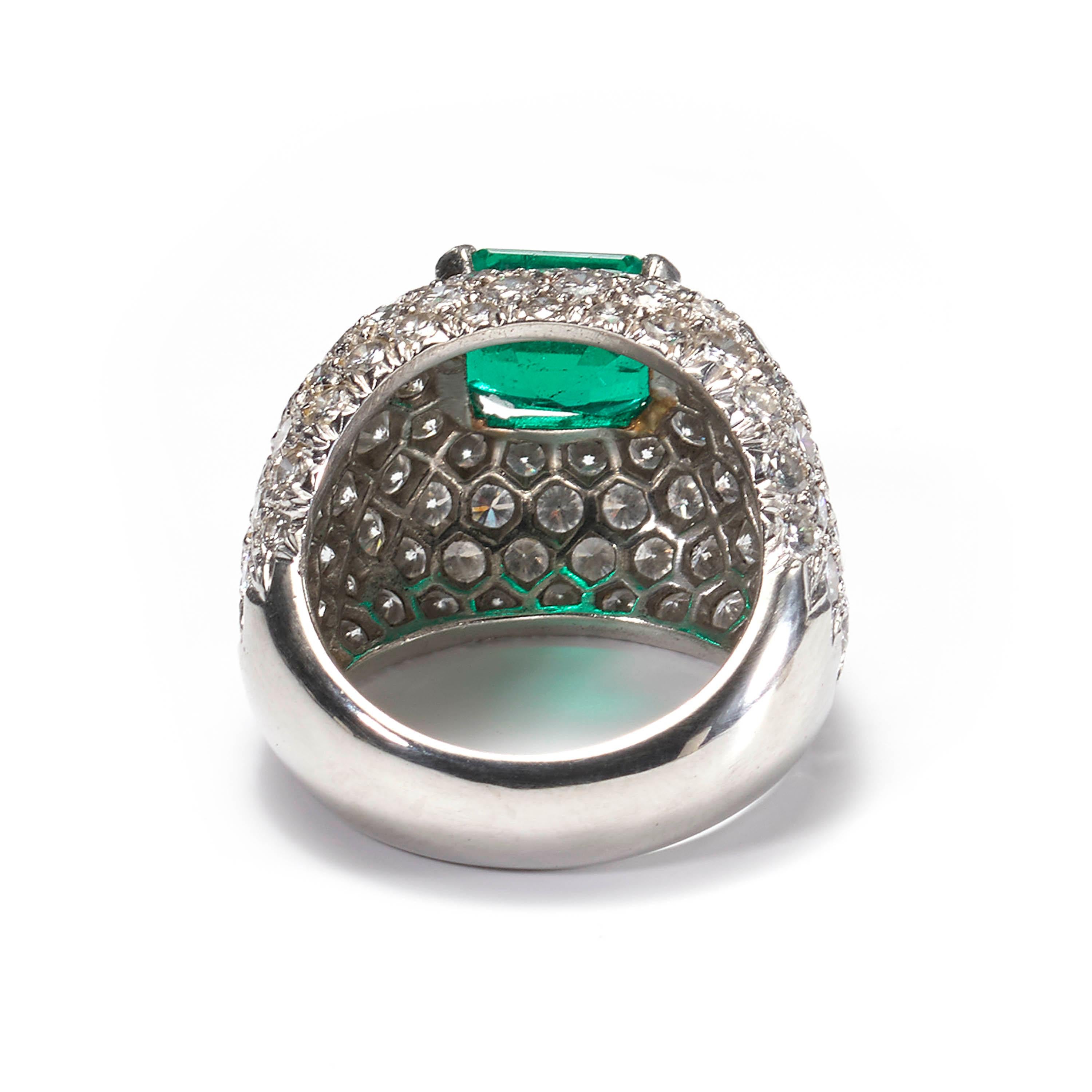 Emerald Cut Emerald and Diamond Bombé Cluster 18 Karat White Gold Ring For Sale