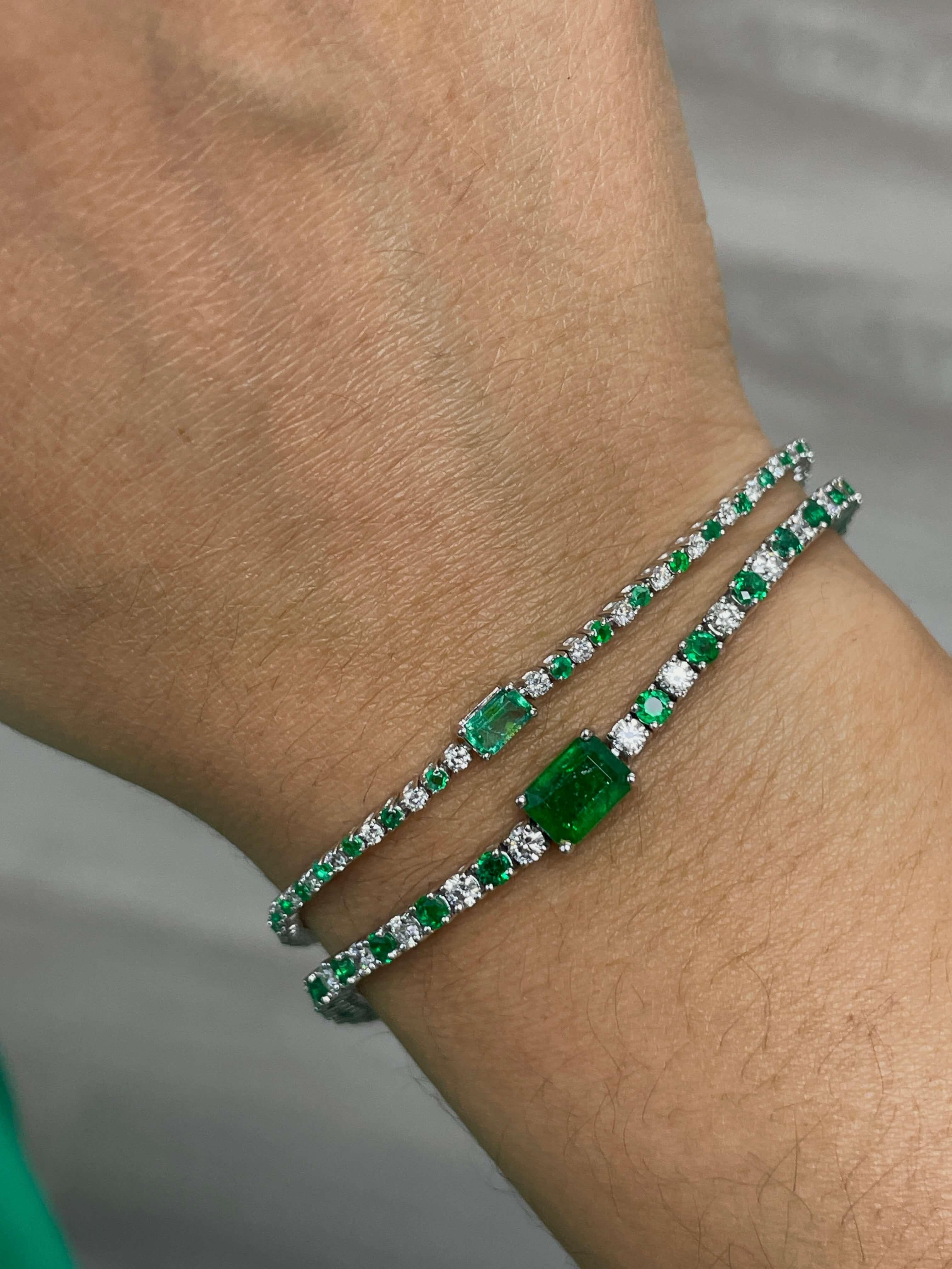 Add a pop of color to your everyday wardrobe with this emerald and diamond bracelet featuring a beautiful emerald center stone and alternating round diamonds and emeralds. Available in two center stone sizes, 7x5 and 5x3.

14K White Gold Emerald and