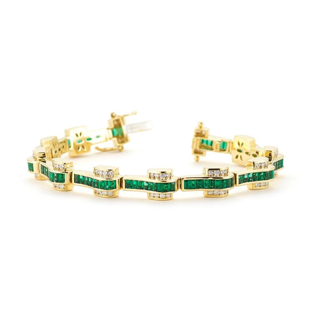 An exquisite Emerald tennis bracelet with diamond details in yellow gold is perfect to dress up or down.
Item:	# 01991
Setting:	18K Y
Lab:	C.Dunaigre
Color Weight:	6.79 ct. of Emerald
Diamond Weight:	3.6 ct. of Diamonds