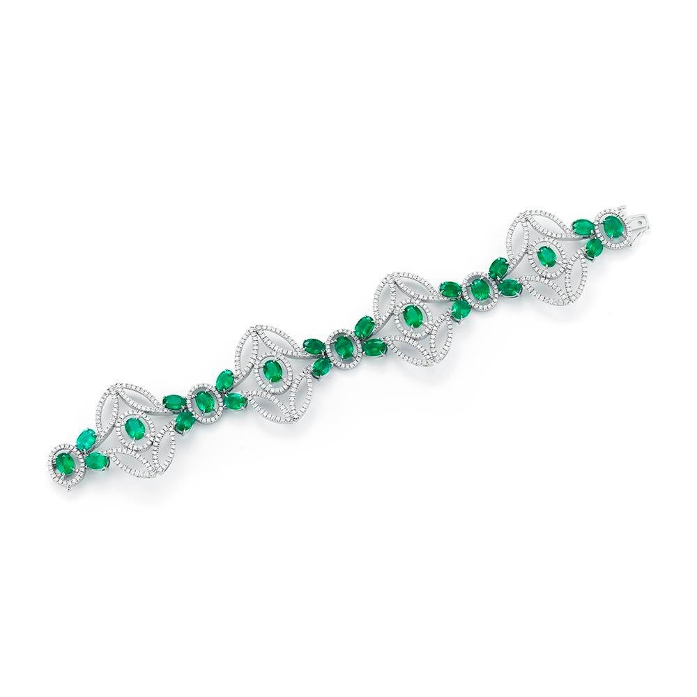 A beautiful airy design with great visual impact features a collection of perfectly matched Zambian emeralds.
Item:	# 02310
Setting:	18K W
Lab:	C.Dunaigre
Color Weight:	23.68 ct. of Emerald
Diamond Weight:	6.61 ct. of Diamonds
