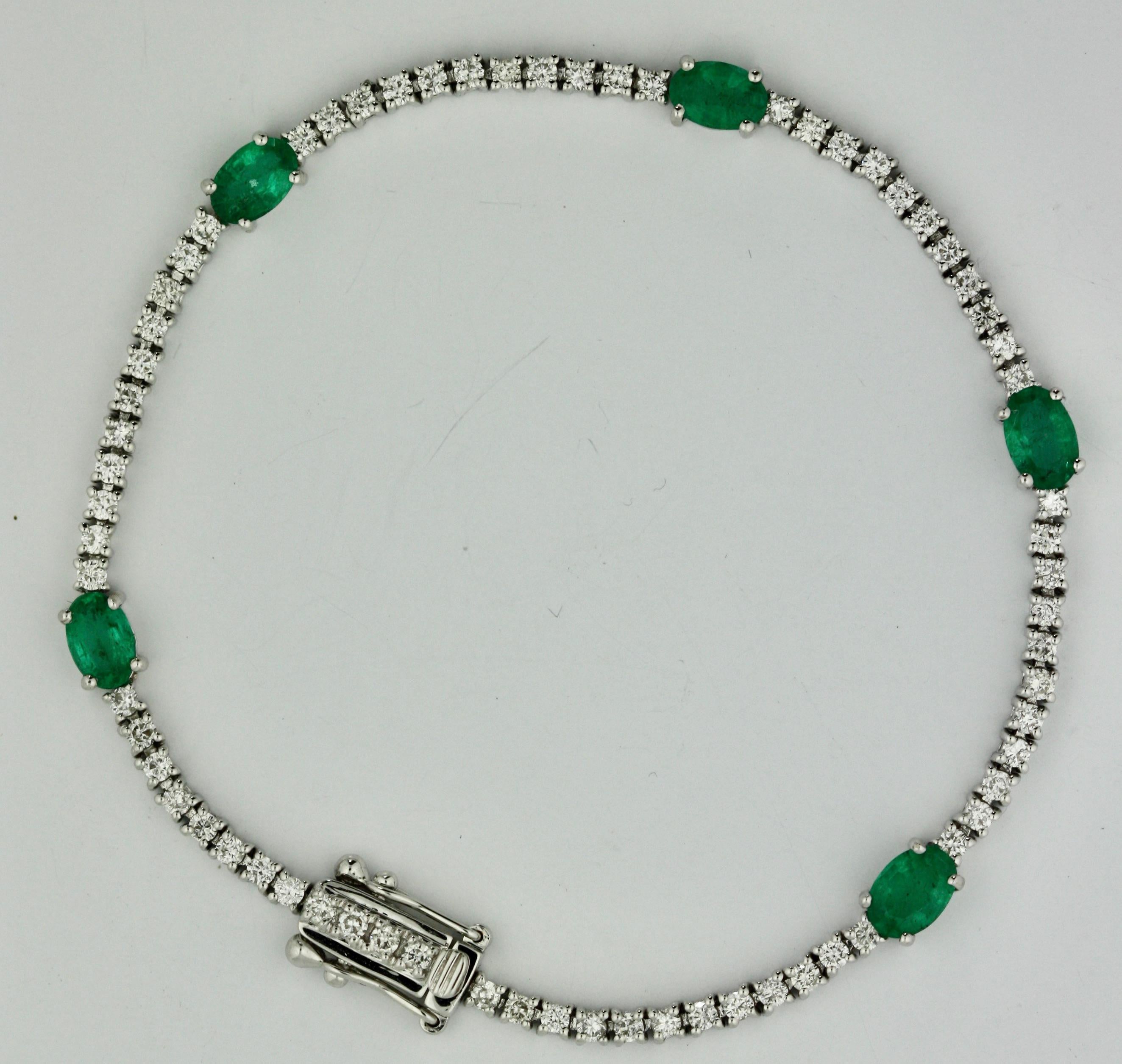 
Emerald and Diamond Bracelet mounted in 18 karat white gold, 7 1/4 inches 
Accompanied by AIGL Appraisal K49E65-EA13018 
Stating: 
18K White gold bracelet mounted with 5 genuine faceted emeralds weighing approximately 1.95 cts., and 68 genuine
