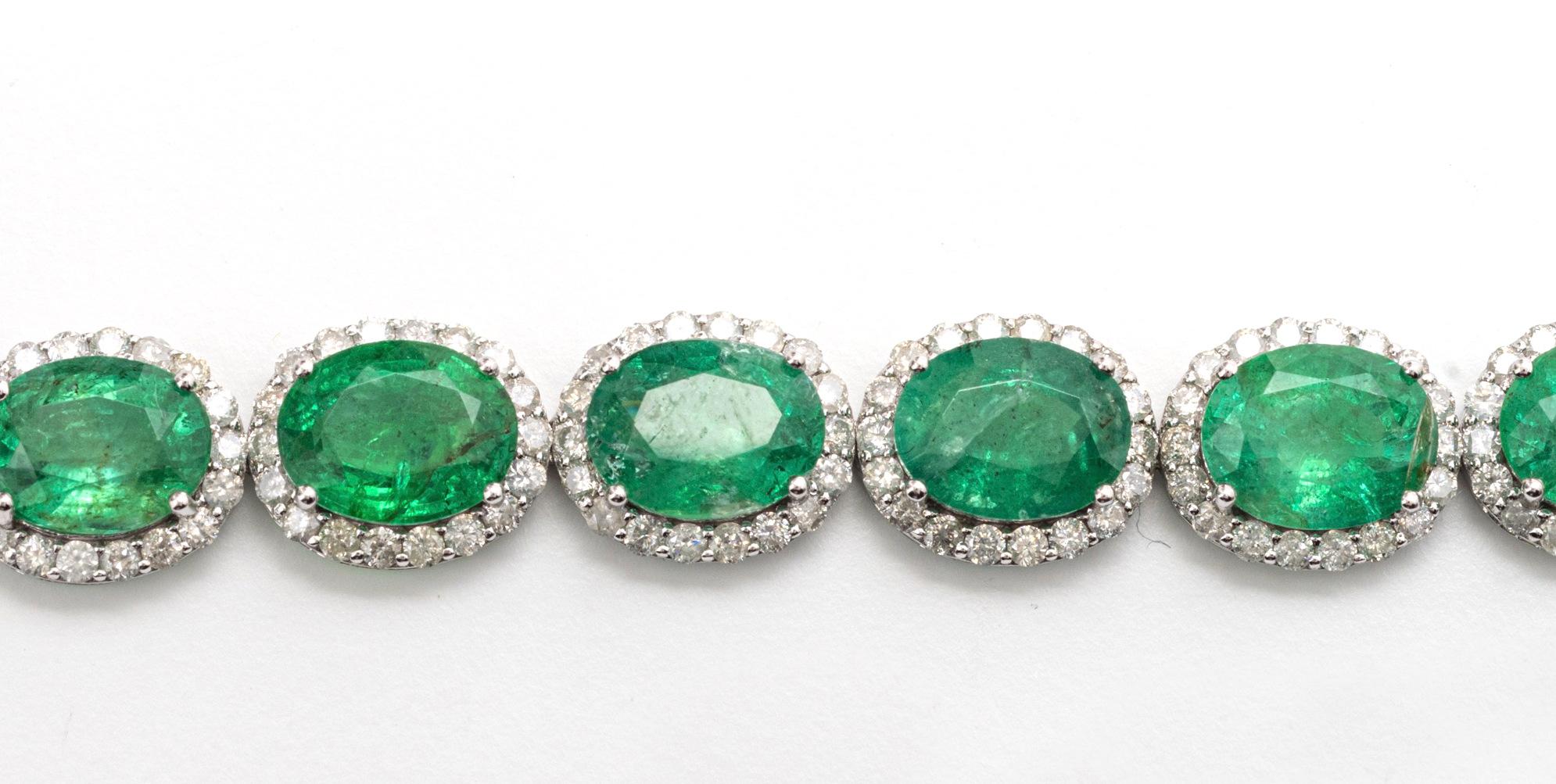 
Emerald and Diamond Bracelet
Set with sixteen oval shaped emeralds weighing approximately 22.93 carats, framed by round diamonds weighing approximately 4.15 carats, mounted in 14 kt gold, length 7 inches.