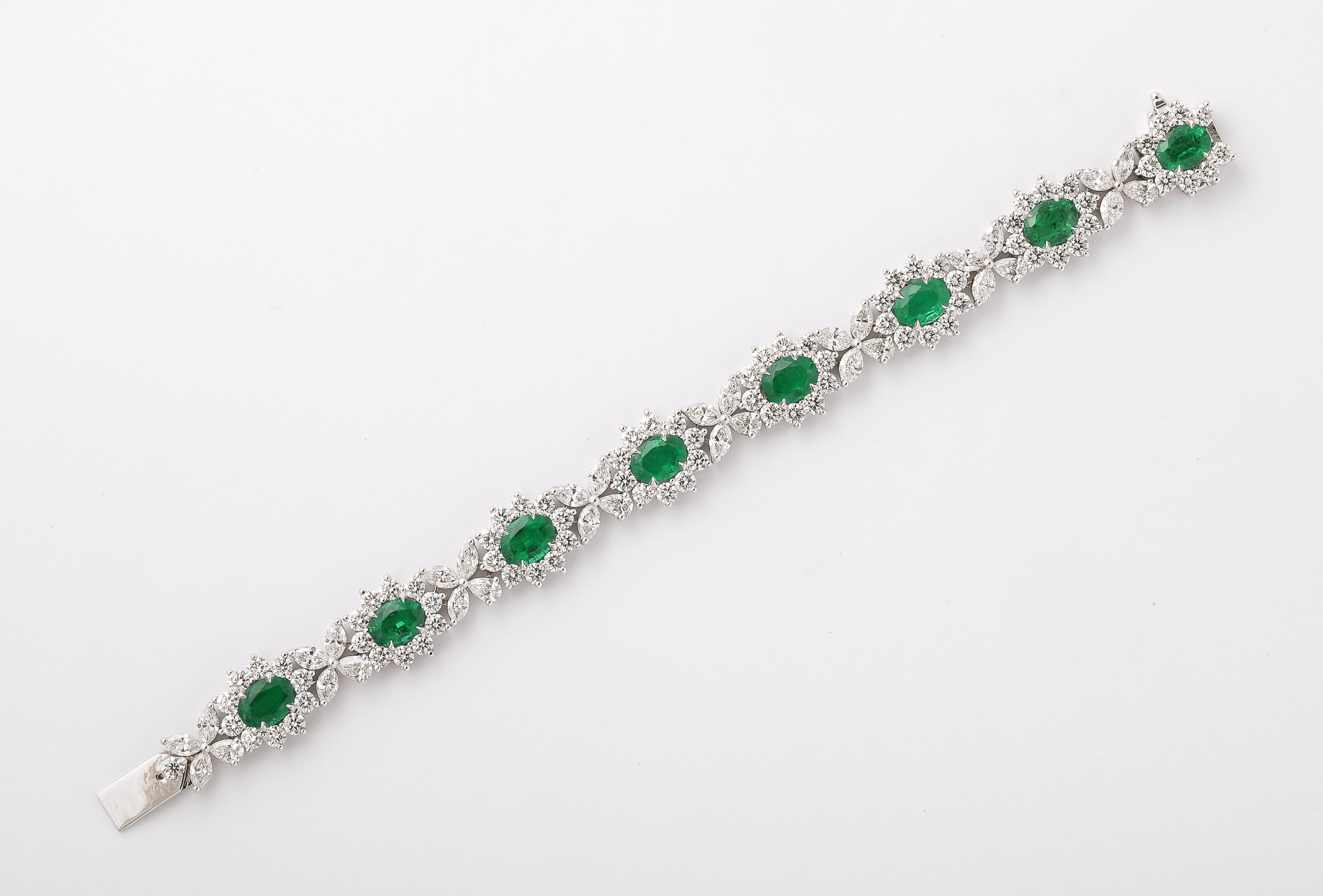 
An EXCEPTIONAL piece! 

9.78 carats of certified Intense to Vivid Green emeralds. 

15.25 carats of white round brilliant, marquise and pear shaped diamonds. 

Set in Platinum. 

6.75 inch length - half an inch wide. 

Certified by Christian