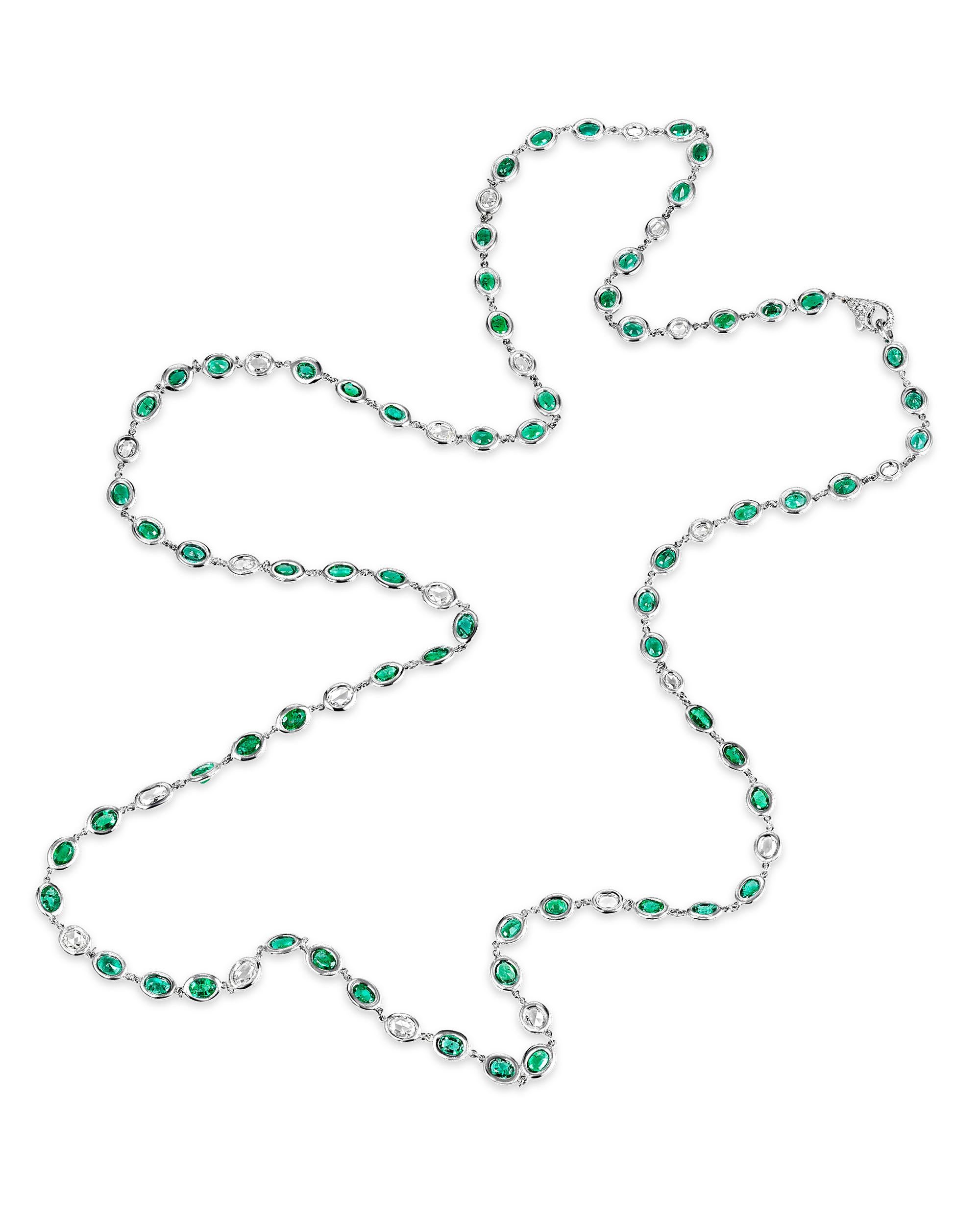 This glamorous chain necklace is inset by beautiful green emeralds totaling 32.50 carats and diamonds totaling 6.20 carats. The subtle beauty of these delicate gems is perfectly complemented by their stylish 18K white gold link setting. Emeralds are