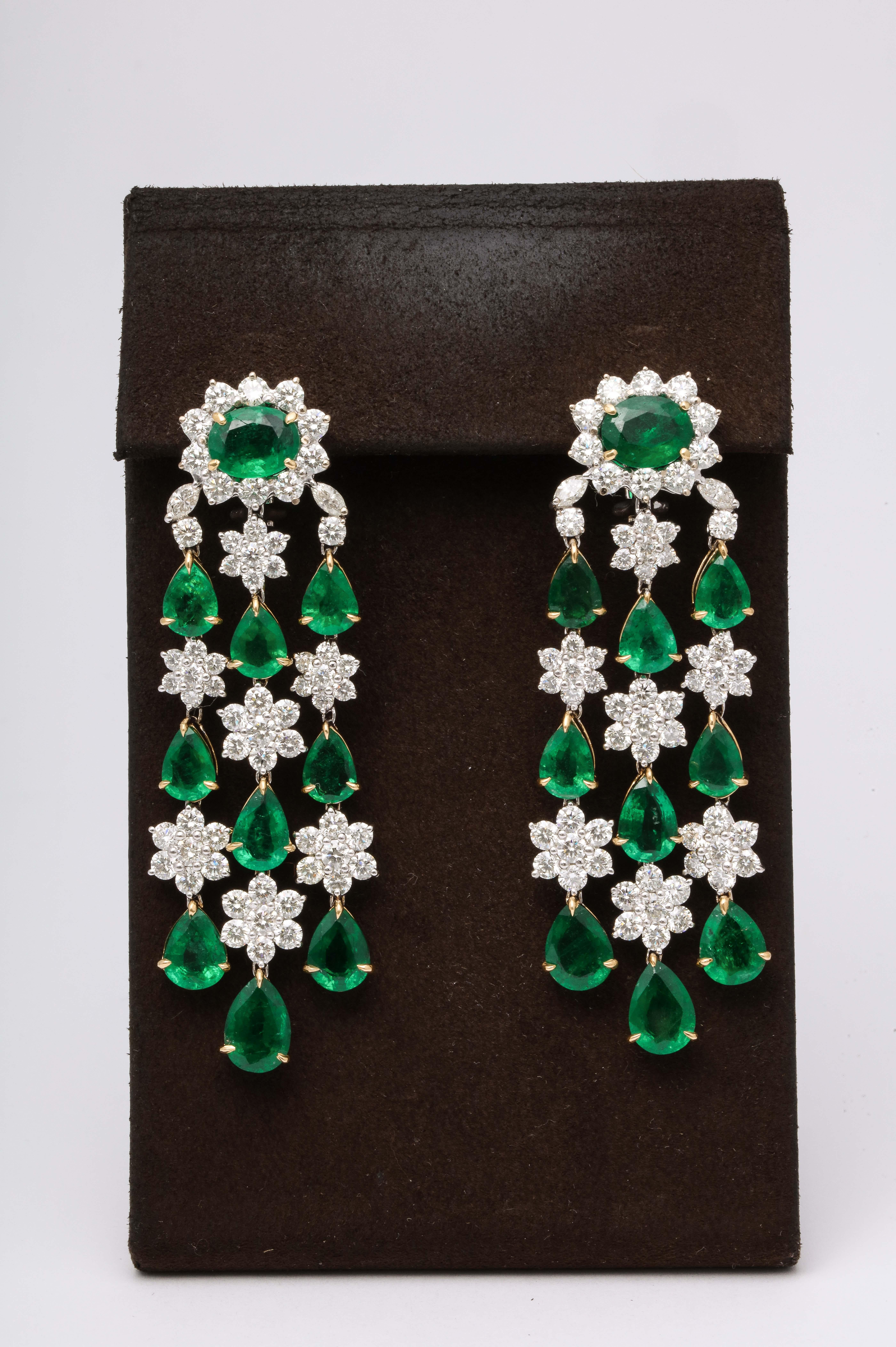 
Fabulous emerald earrings with great movement.

24.93 carats of fine green emeralds

12.21 carats diamonds

18k white and yellow gold 

Approximately 2.75 inches long, .78 inches wide.

