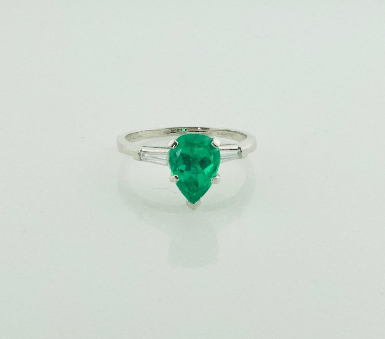 Pear Cut Emerald and Diamond Classic Solitaire Ring in Platinum For Sale