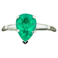 Retro Emerald and Diamond Classic Solitaire Ring in Platinum
