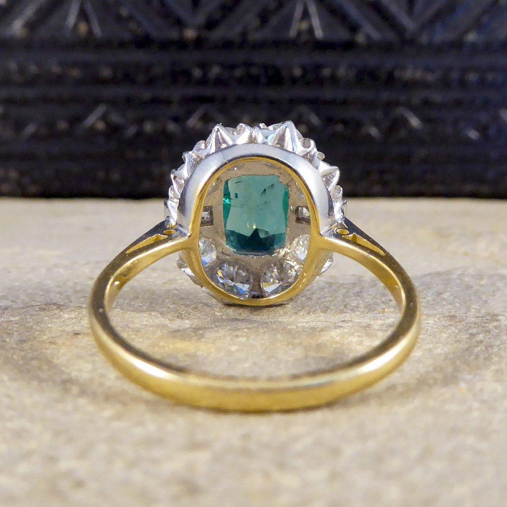 Emerald Cut Emerald and Diamond Cluster Engagement Ring For Sale