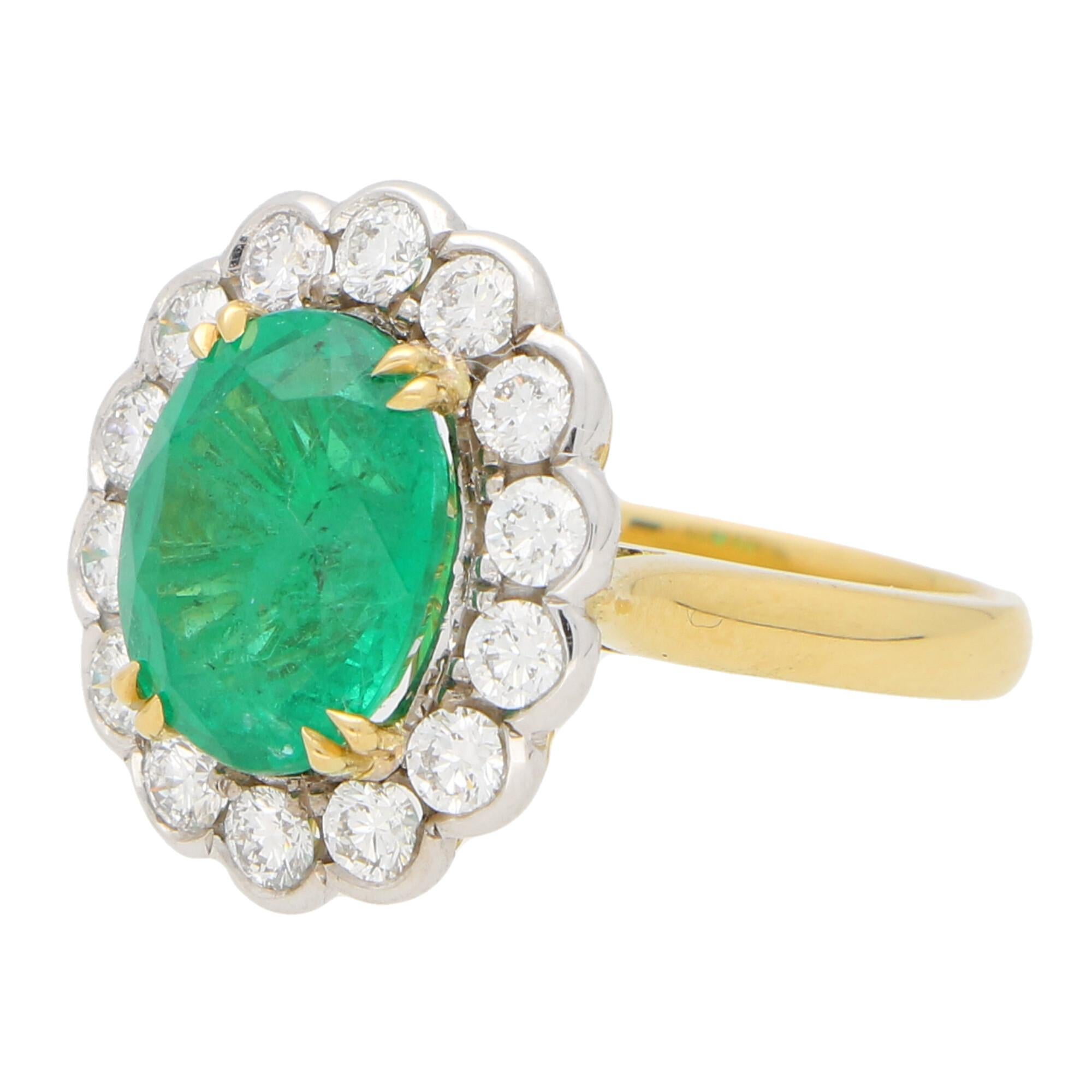 A truly stunning emerald and diamond cluster ring set in 18k yellow and white gold.

The piece is centrally set with an astounding 3.79 carat oval cut emerald which is claw set in yellow gold. The emerald has a fantastic vibrant green colour to it