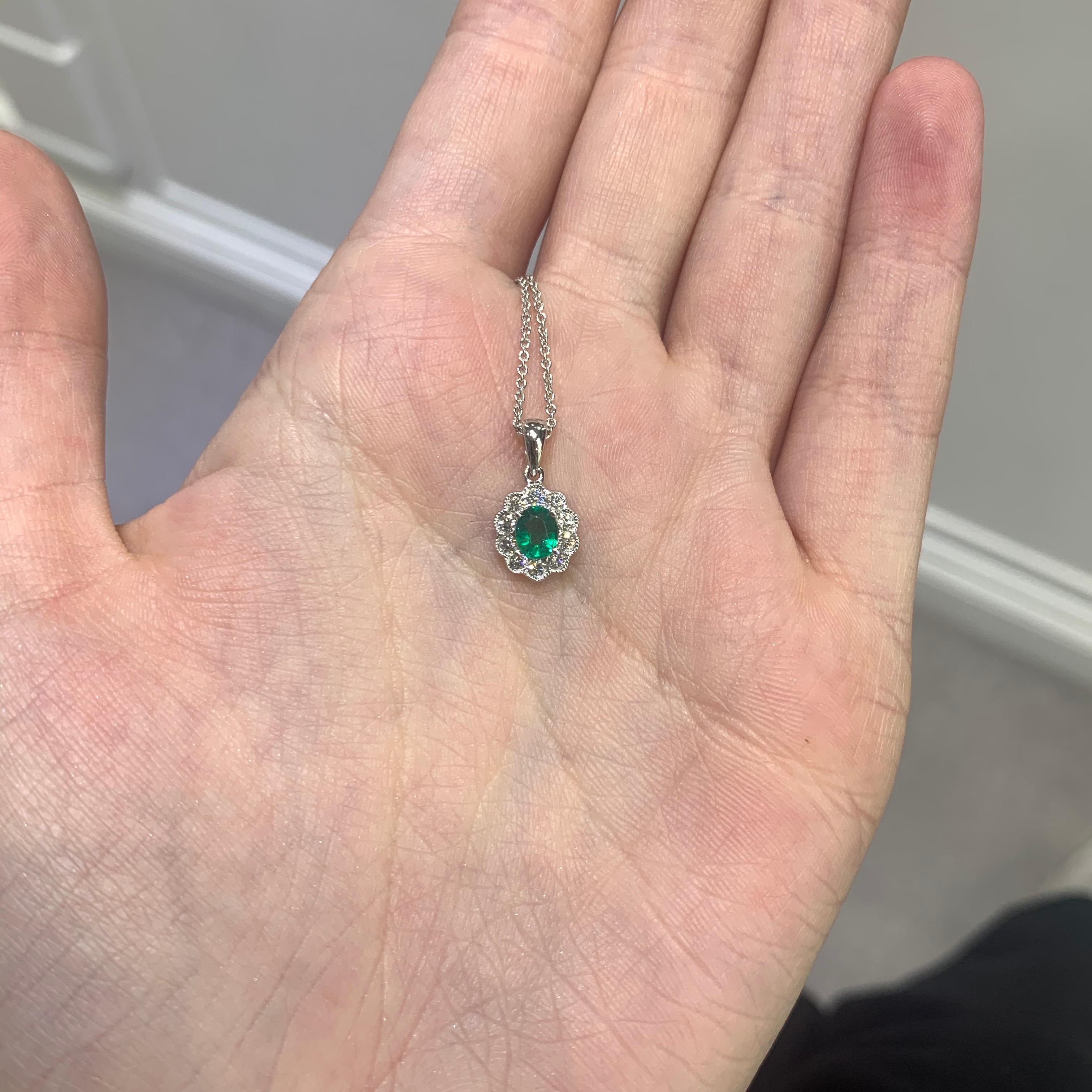 Oval Cut Emerald and Diamond Cluster Pendant Set in 18 Karat White Gold