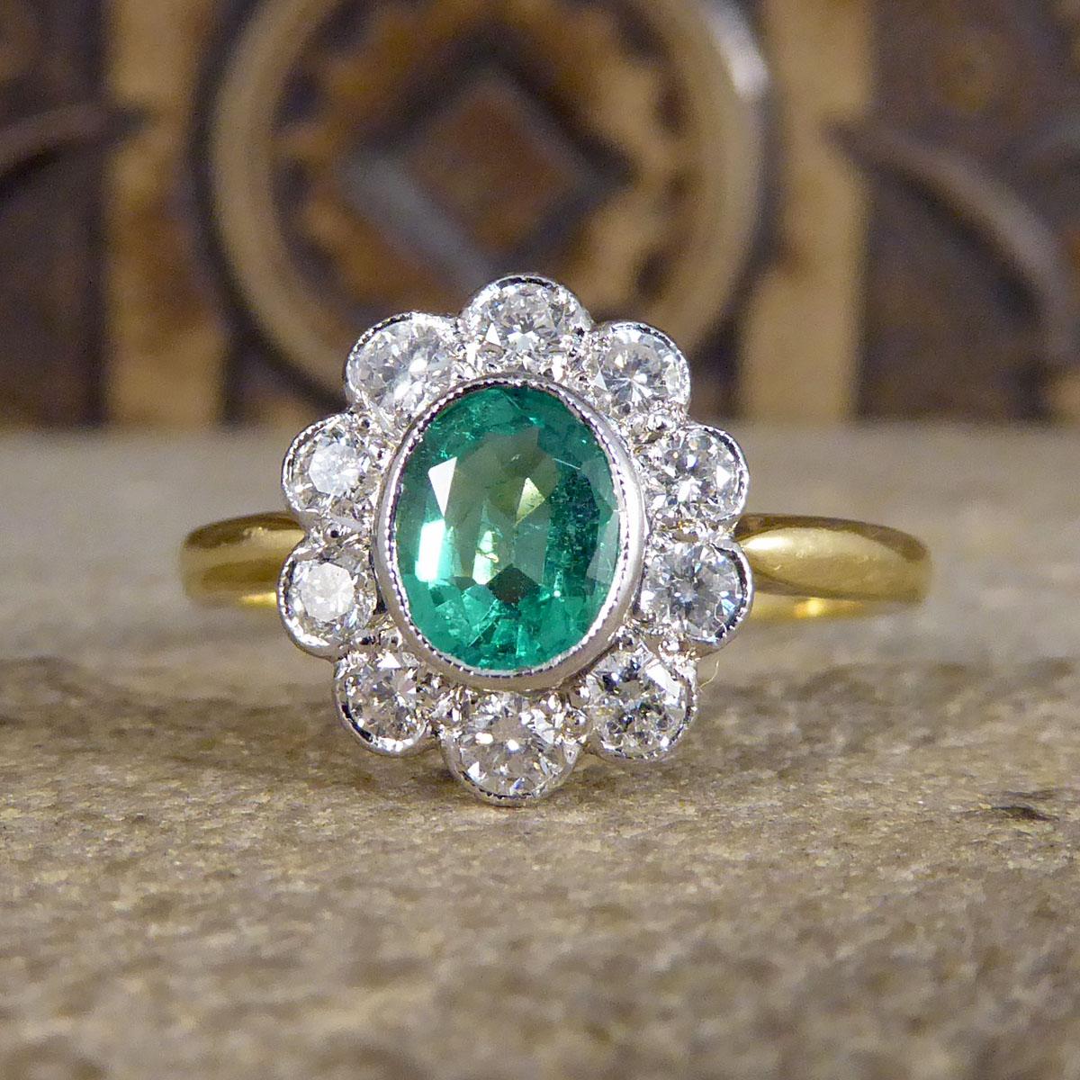 Oval Cut Emerald and Diamond Cluster Ring in 18ct Yellow and White Gold