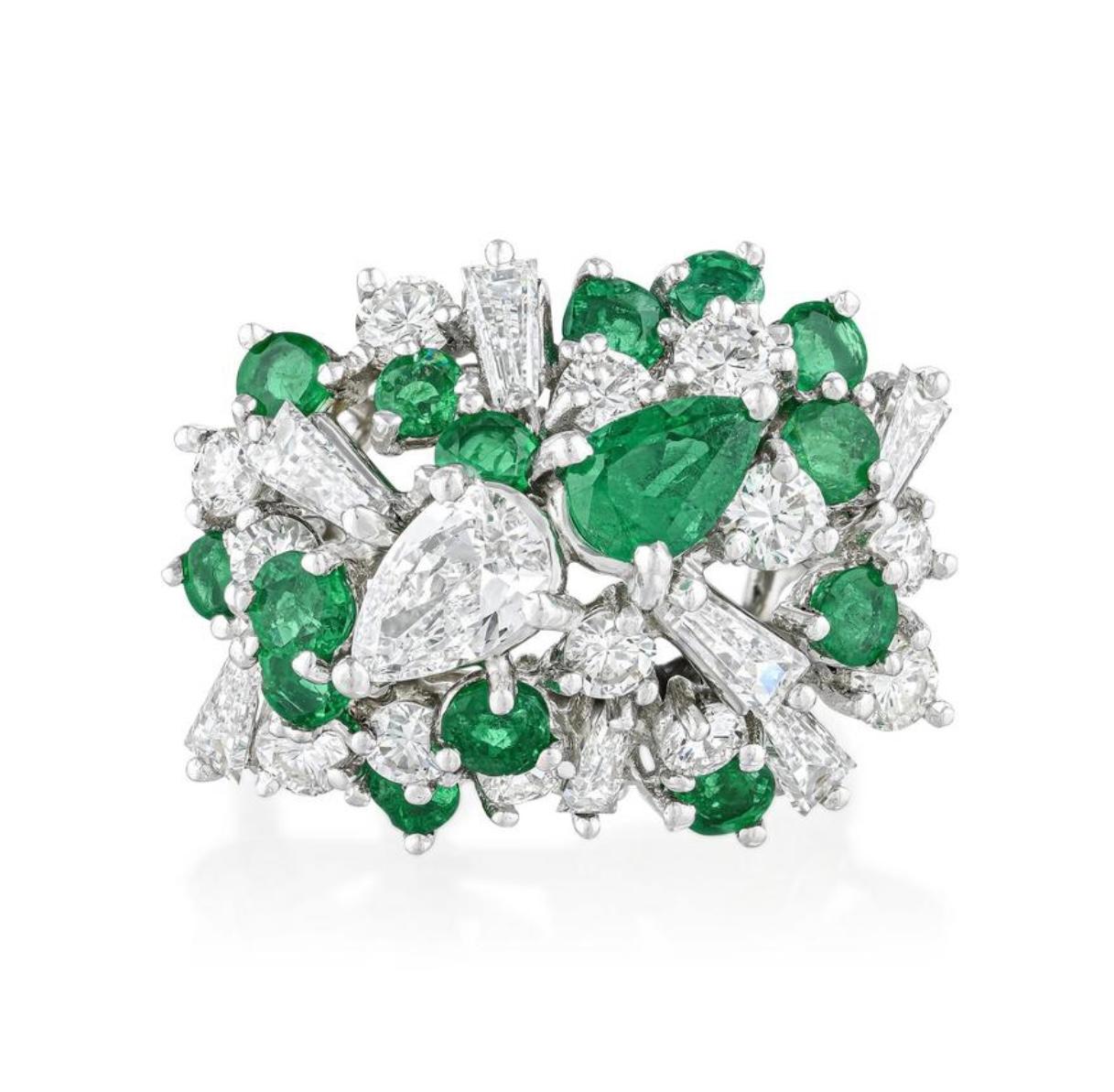 Emerald and diamond cluster ring in Platinum. 

The details are as follows : 

Diamond weight : 1.90 carats 
Emerald weight : 1.50 carats 

Metal : 18 K white gold 
Ring size : 4 1/2 
Measurements: 3/45x1/2inch, height 5/8inch
weight : 8.80 grams 
