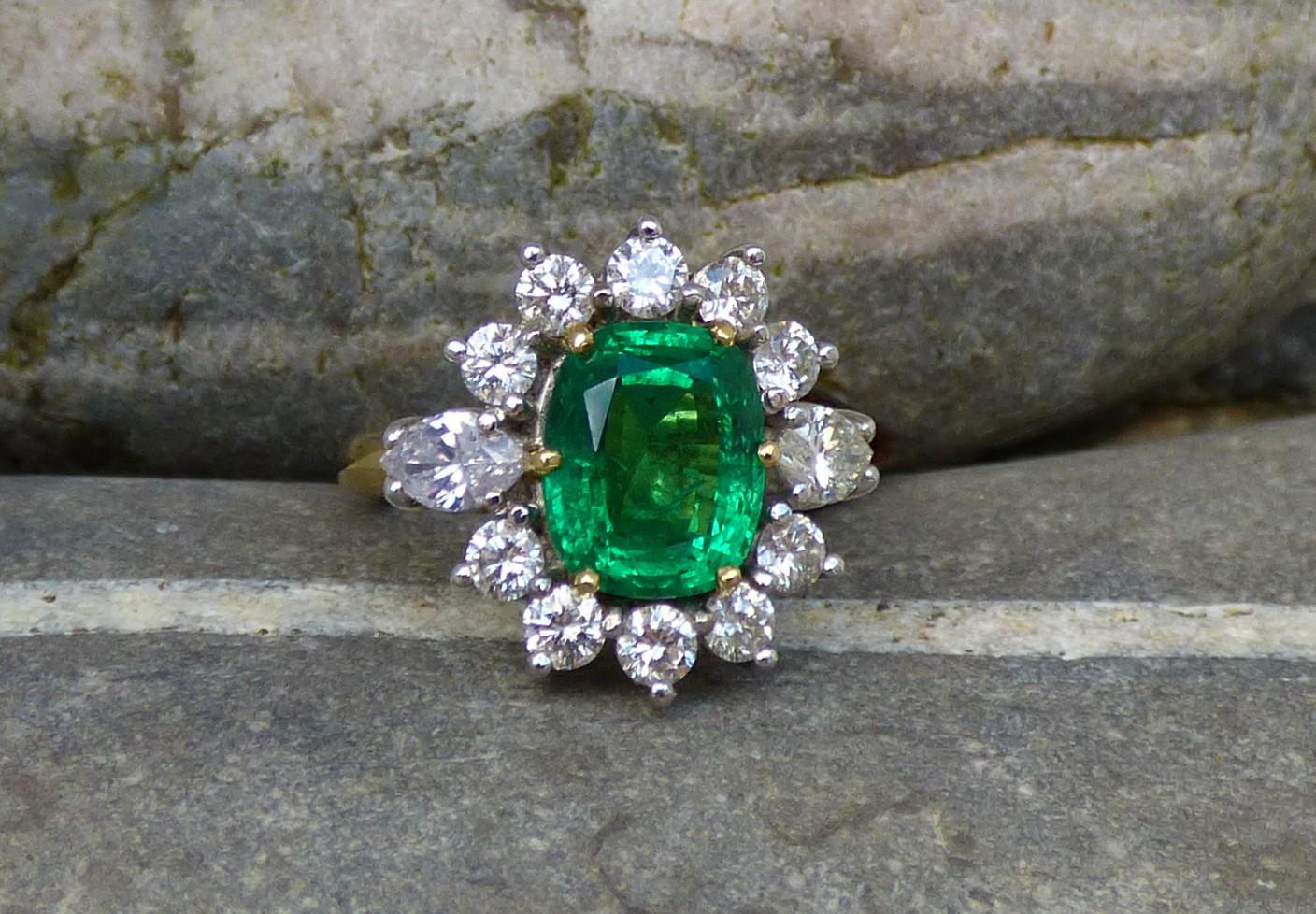 Oval Cut Emerald 2.58ct. and Diamond Cluster Ring in 18K Yellow and White Gold For Sale
