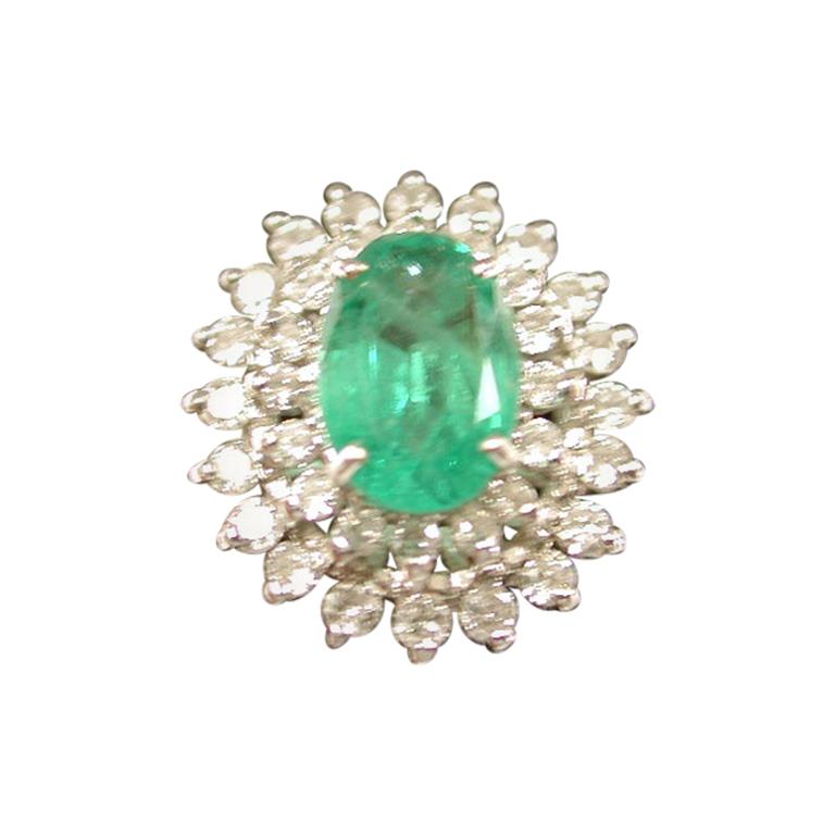 Emerald and Diamond Cluster Ring Mounted in 18 Carat Gold, London, 1979 For Sale