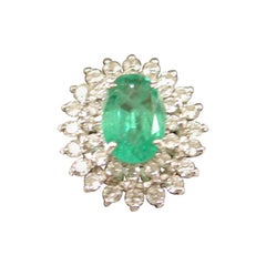 Emerald and Diamond Cluster Ring Mounted in 18 Carat Gold, London, 1979