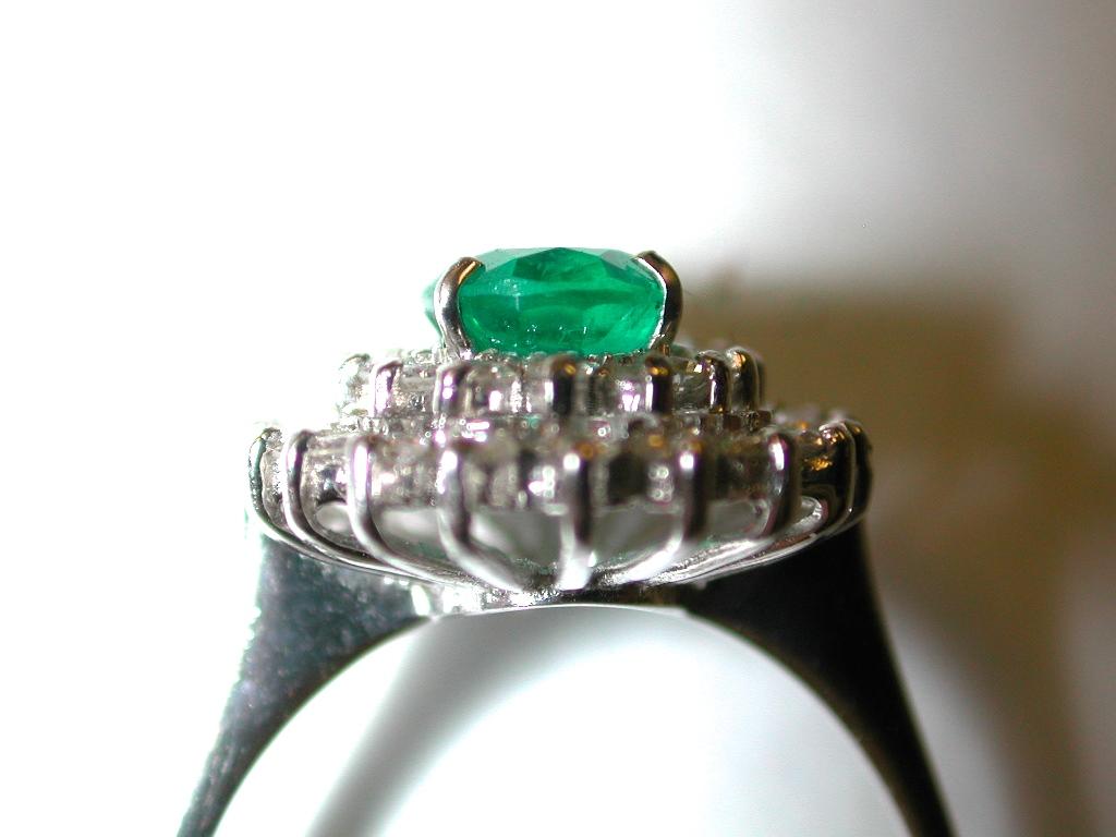 Women's Emerald and Diamond Cluster Ring Mounted in 18 Carat Gold, London, 1979 For Sale