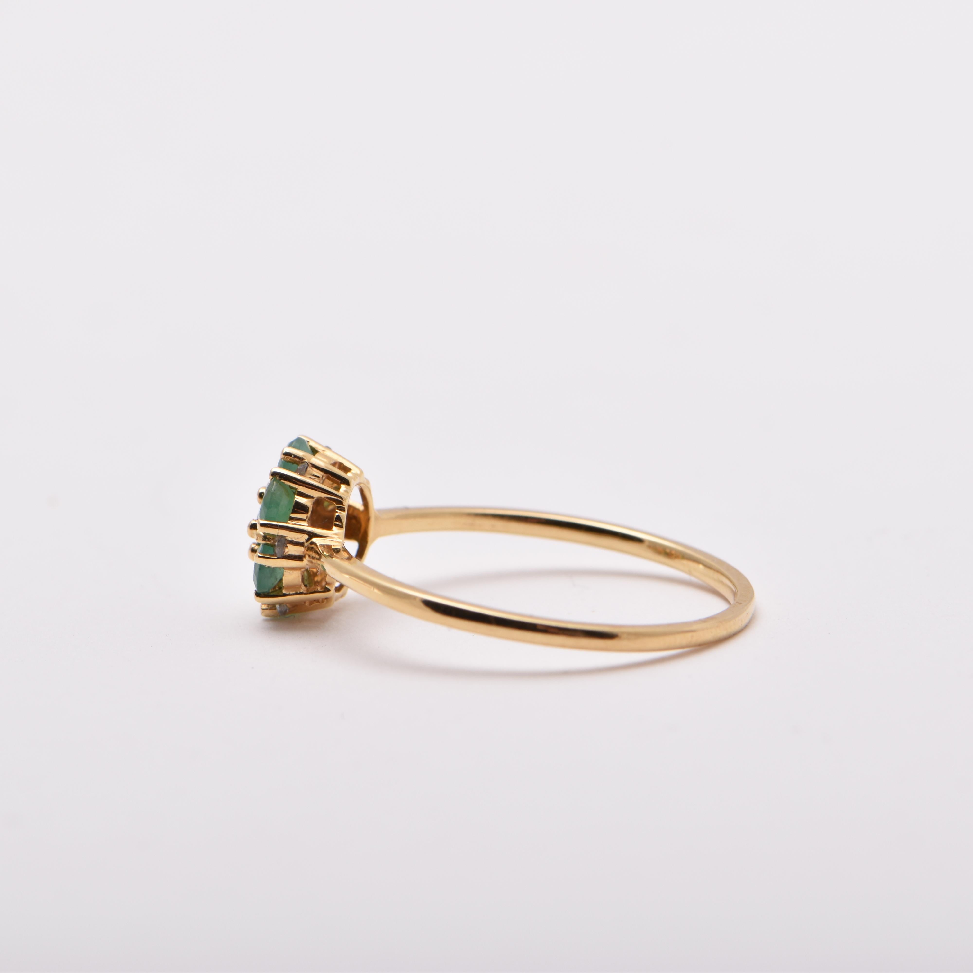 Round Cut Emerald and Diamond Cluster Style Ring in 18 Carat Yellow Gold For Sale