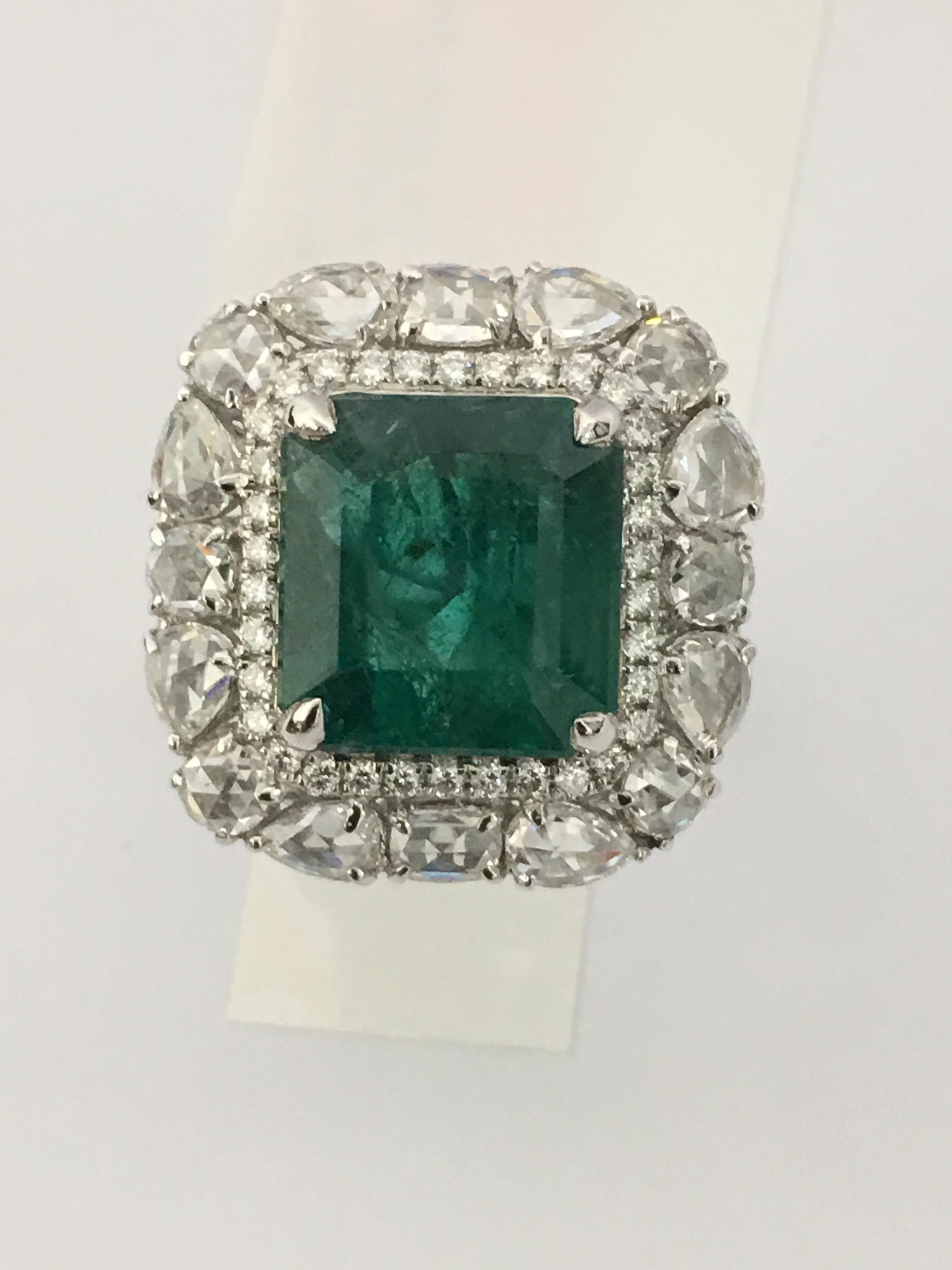 Natural square Emerald  weigh 6.54 Carat and 3.32 Carat Diamonds full cut round and rose cut .
Quality of Emerald is exceptional. Very less inclusion.
The Ring is set in 18 Karat White Gold.
Size of the Ring is 7.5 ( can be resized)
The ring is