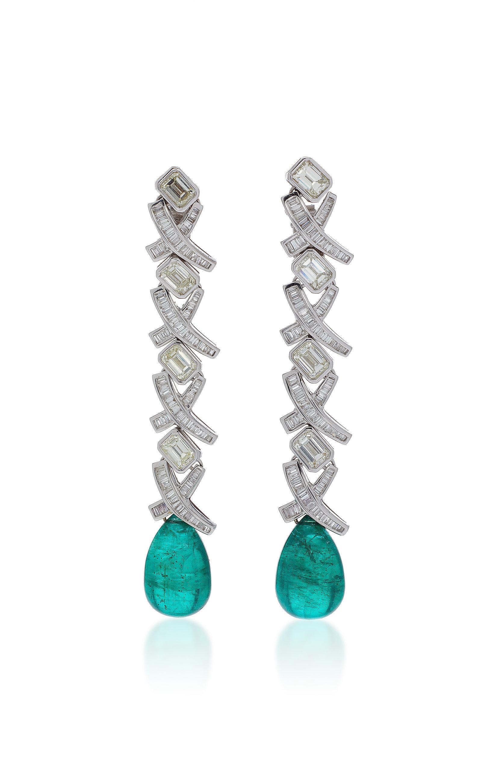 A pair of beautiful ear-pendants in 18kt white gold with eight emerald cut diamonds (app. 0.5cts each), highlighted by baguette cut diamonds and two emerald drops (14 cts each). Made in Italy, circa 1980