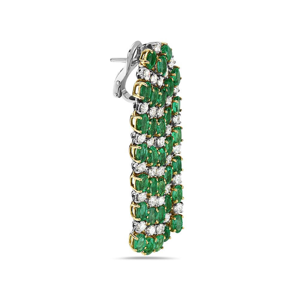 These standout chandelier earrings feature 15.08 carats of emeralds and 4.70 carats of G VS diamonds set in 18K yellow and white gold. Clamp post back for pierced ears. 33 grams total weight. Made in Italy.