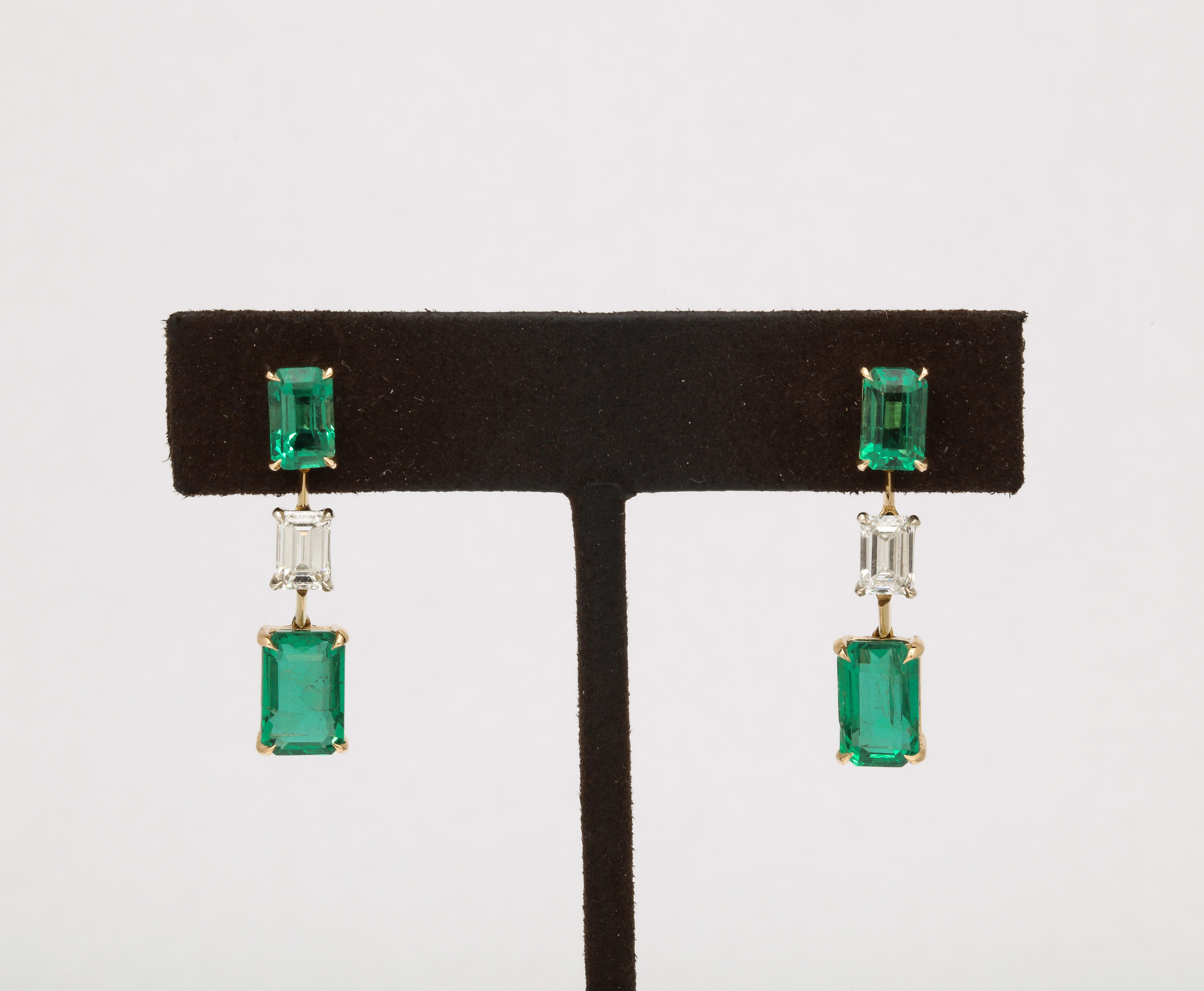 A beautiful pair of earrings with fantastic movement. 

7.36 carats of Fine Emeralds 

1.15 carats of diamonds 

14k yellow gold 

Approximately 1.20 inches long. 
