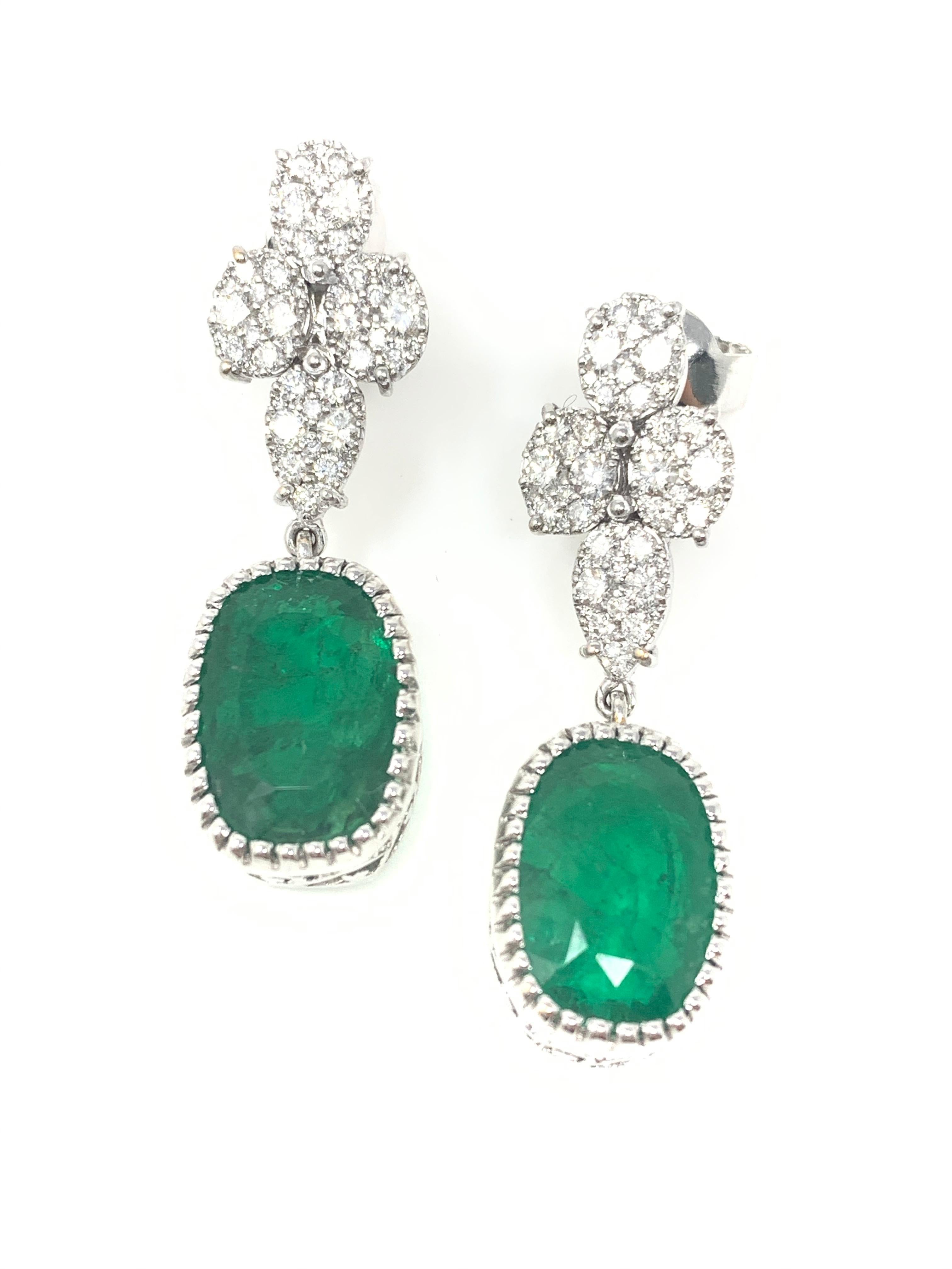 Moguldiam Inc Emerald and diamond dangle earrings custom handmade in 18k white gold. 

Emerald weight : 15.88 carat 
Diamond weight : 1.50 carat 
Metal : 18 K white gold 
measurements: 1 1/2 inches long