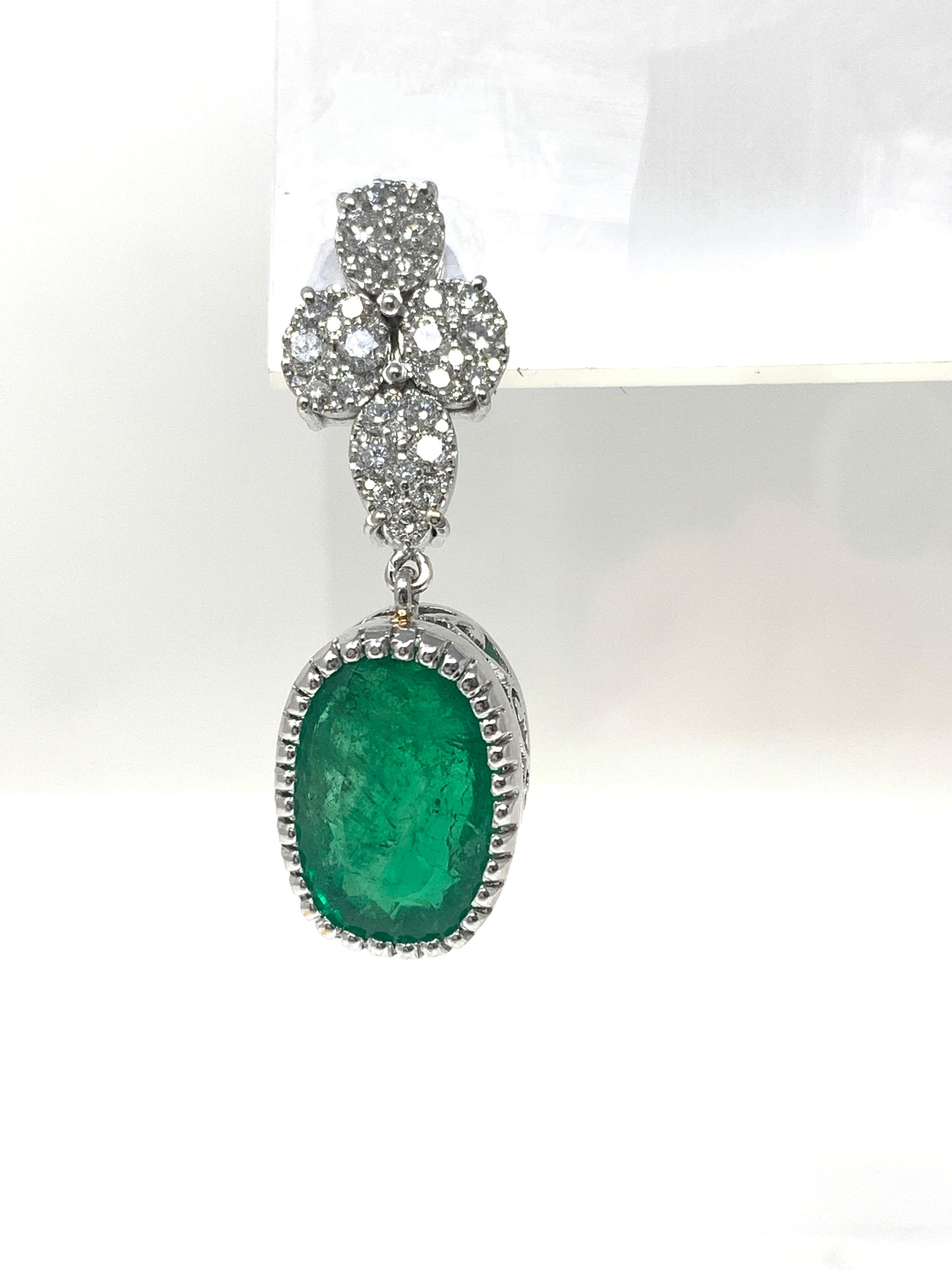 Oval Cut Emerald and Diamond Dangle Earrings in 18 Karat White Gold