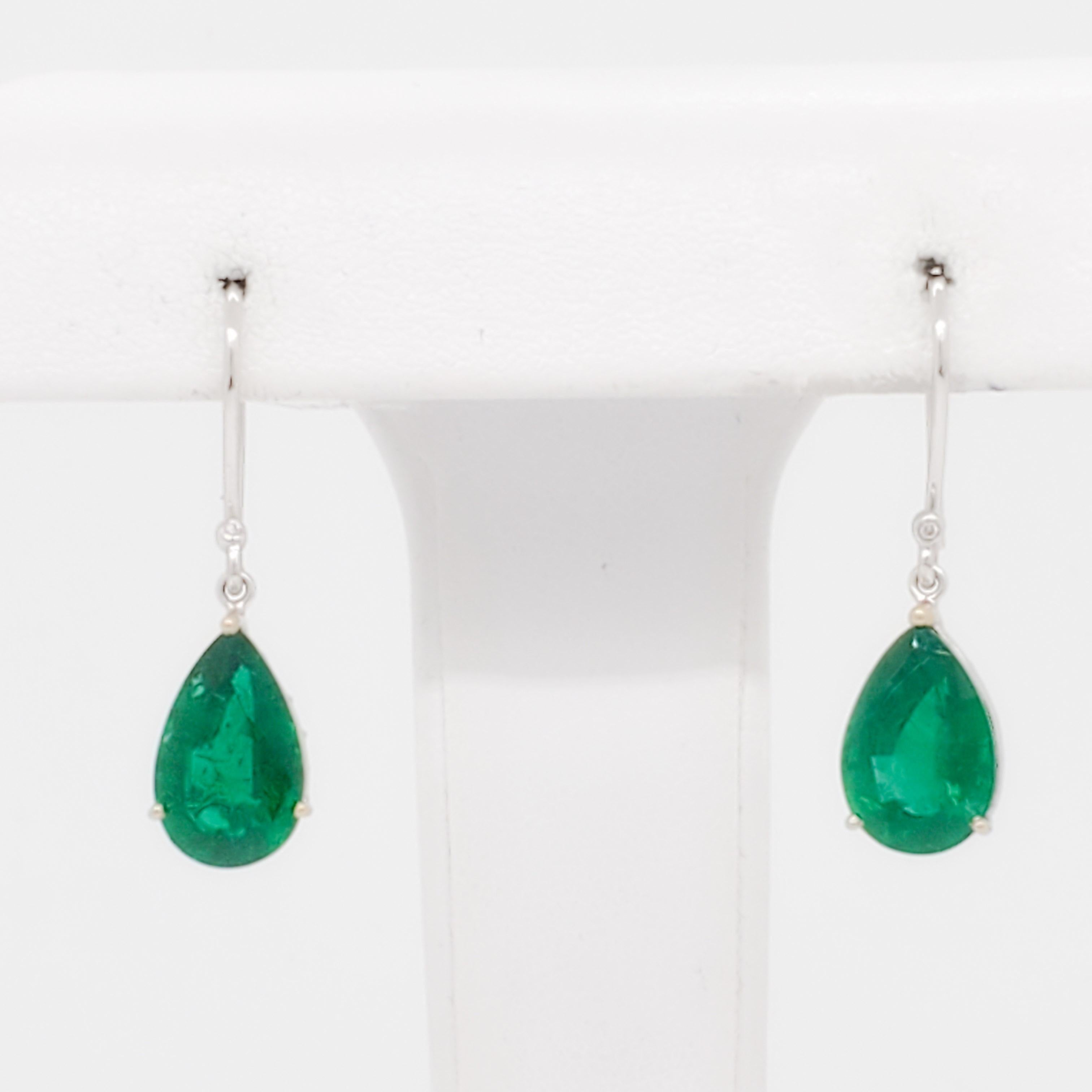 Gorgeous 6.51 ct. emerald pear shapes with 0.01 ct. diamond rounds.  Handmade in 18k yellow and white gold.  