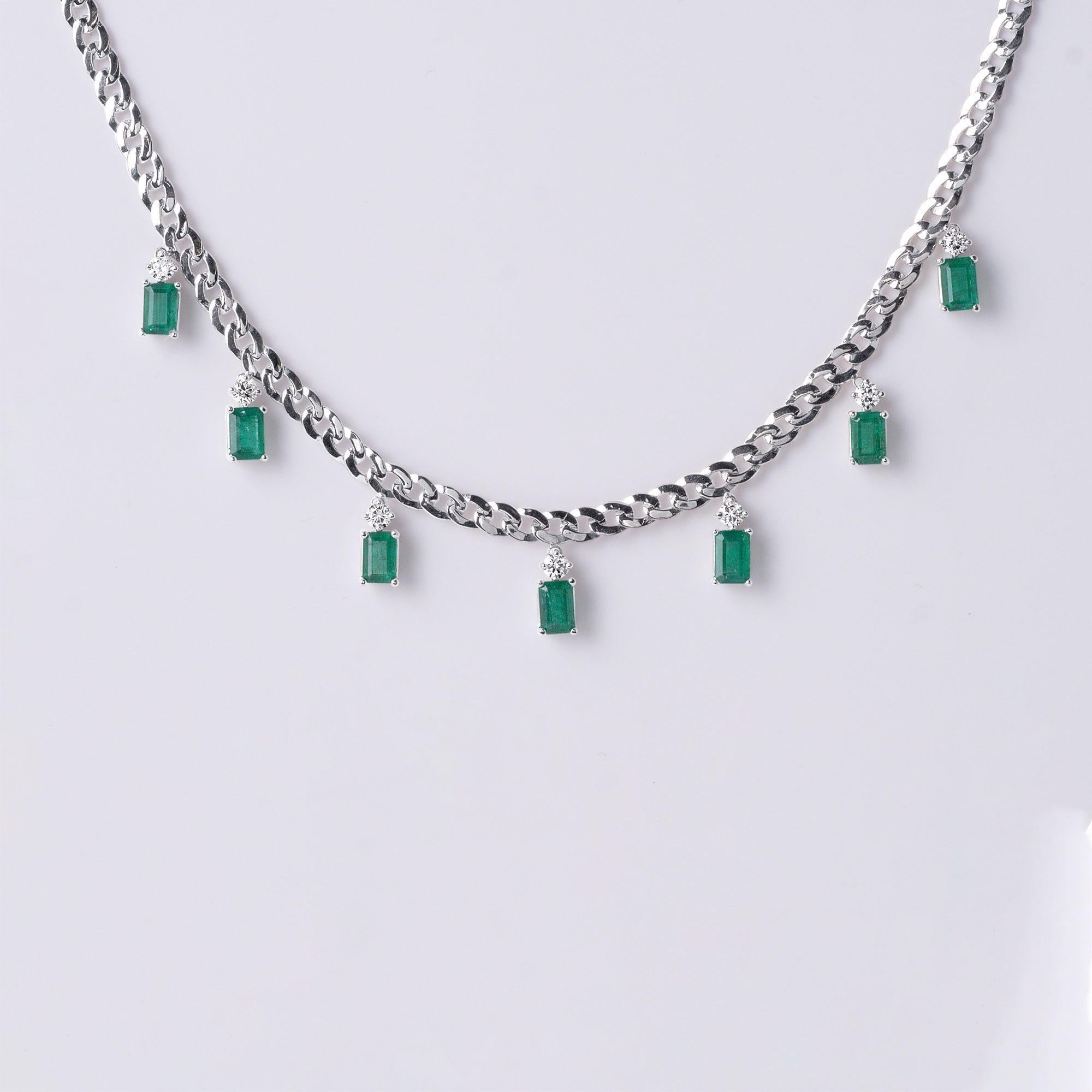 This chic necklace features a dazzling combination of 7 deep green Zambian emeralds and white, clean natural sparkling diamonds, elegantly set on an 18k white gold Cuban link chain.

Emerald Weight: ~2.50 carats of Zambian emeralds
Diamond Weight: