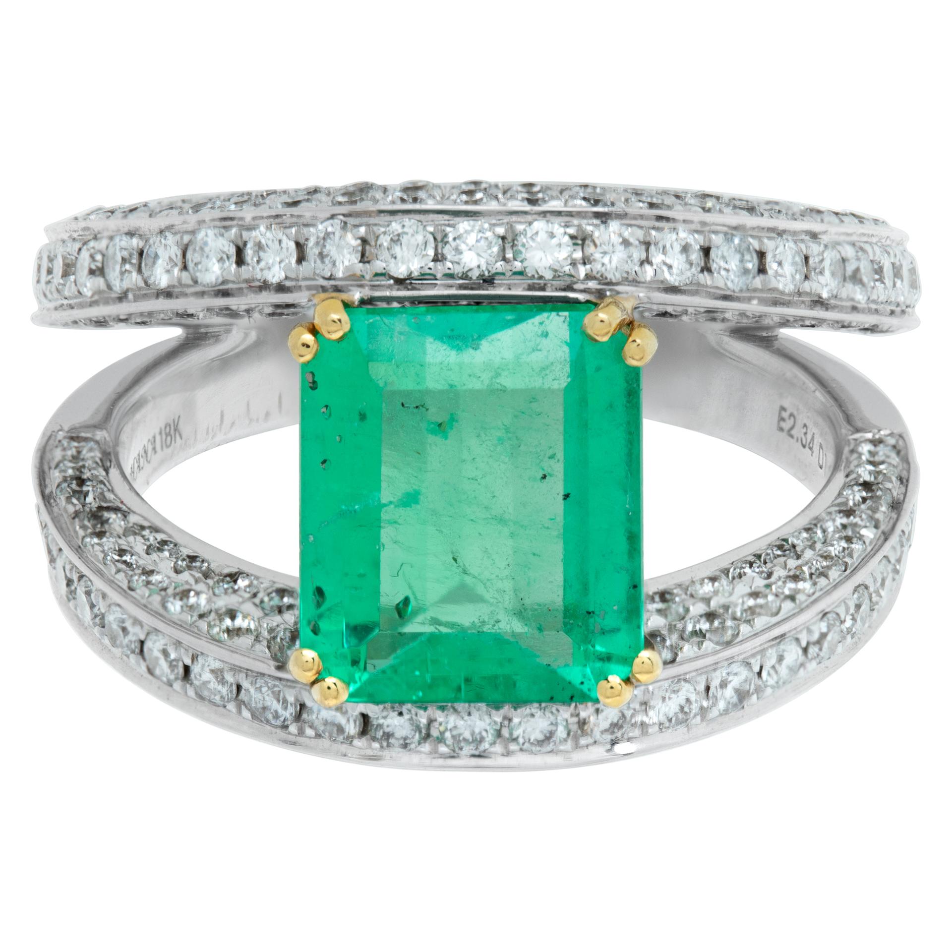 Double band ring in 18k white gold with center Emerald weighing 2.34 carats and 1.52 carats in surrounding round brilliant cut pave diamonds. Size 6.5.

This Diamond/Emerald ring is currently size 6.5 and some items can be sized up or down, please