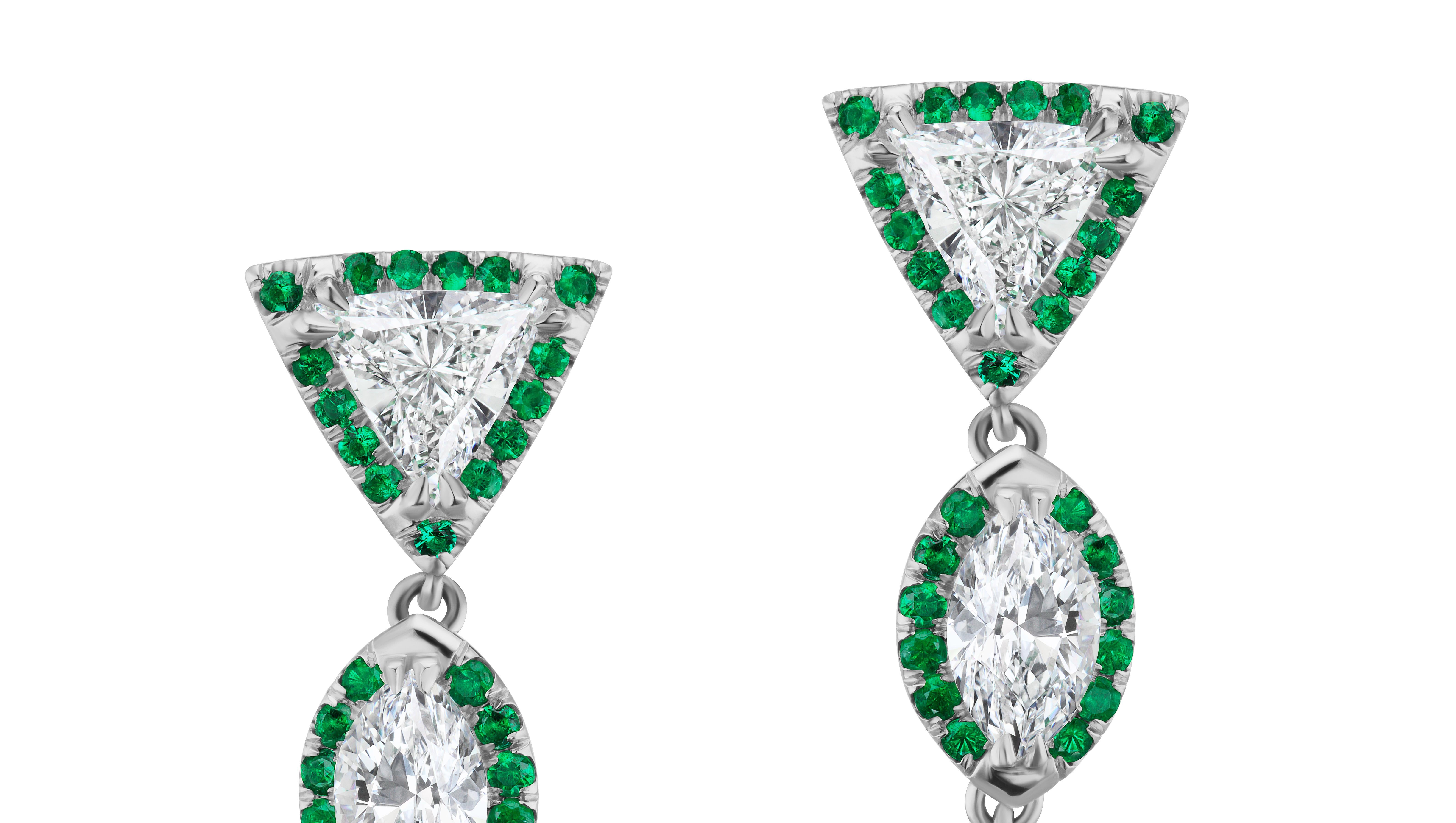 Unique and Fine Emerald Drop Earrings certified by AGL as Fancy Shape for their unique cutting first seen.
One stone is hard to find and even cut. Two Stones is ultra rare. 
Detail and contrast throughout this earring.
Emeralds weigh 5.75