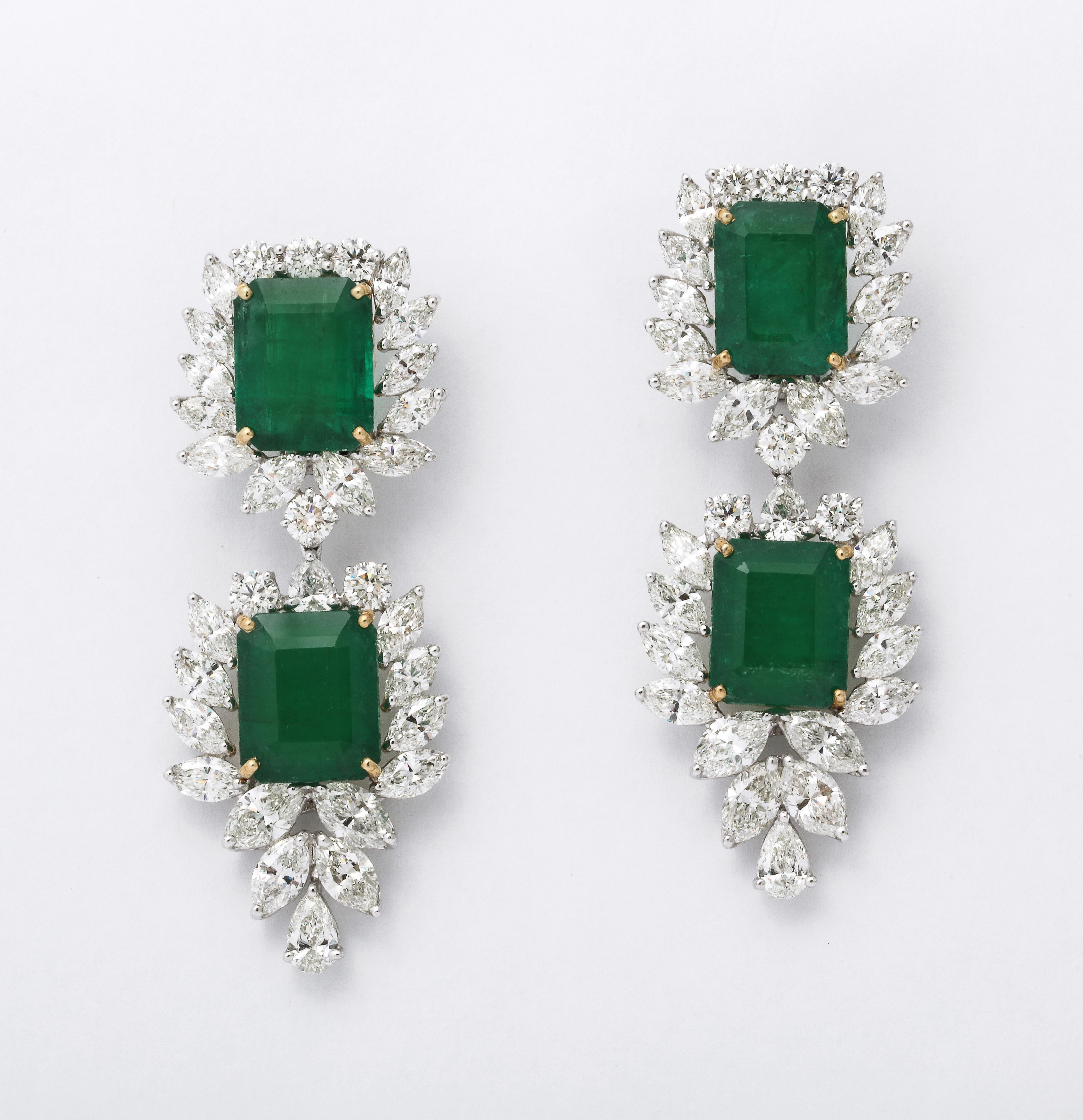 
An important pair of beautiful Emerald and Diamond Drop Earrings. 

38.09 carats of fine emerald cut green Emeralds.

22.10 carats of white pear shape, marquise and round brilliant cut diamonds. 

Set in platinum and 18k yellow gold.