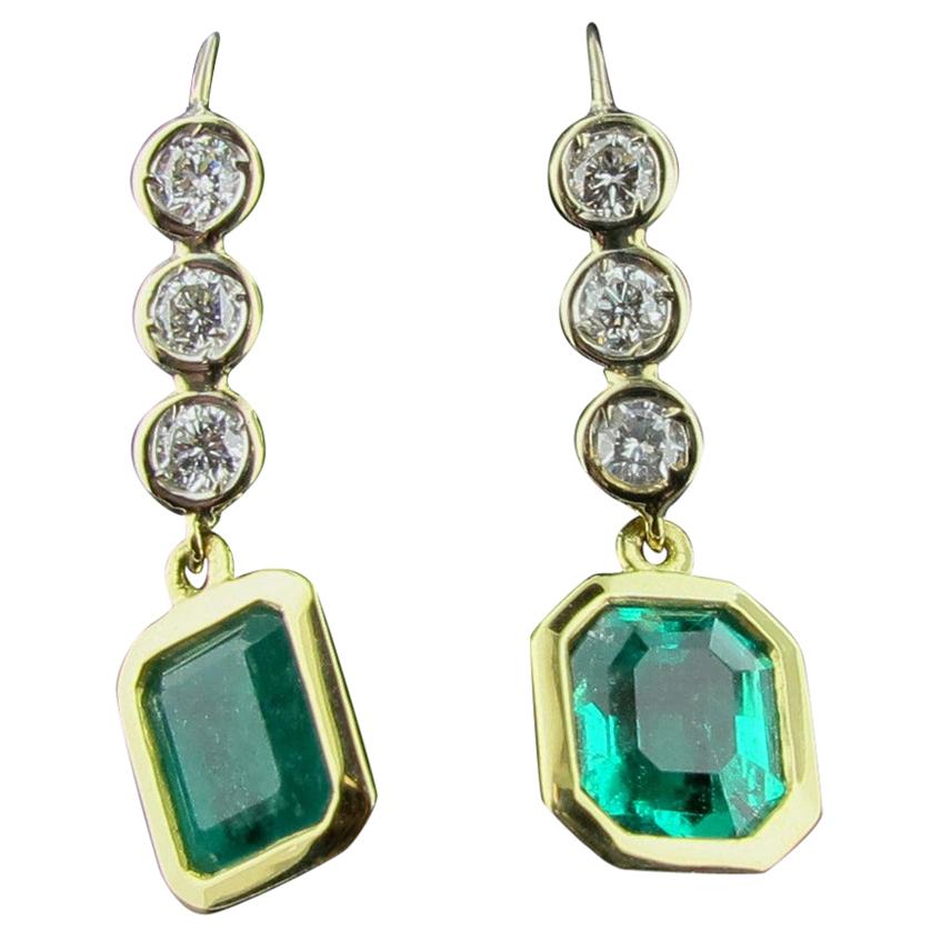 Emerald and Diamond Drop Earrings in 14 Karat White and Yellow Gold For Sale