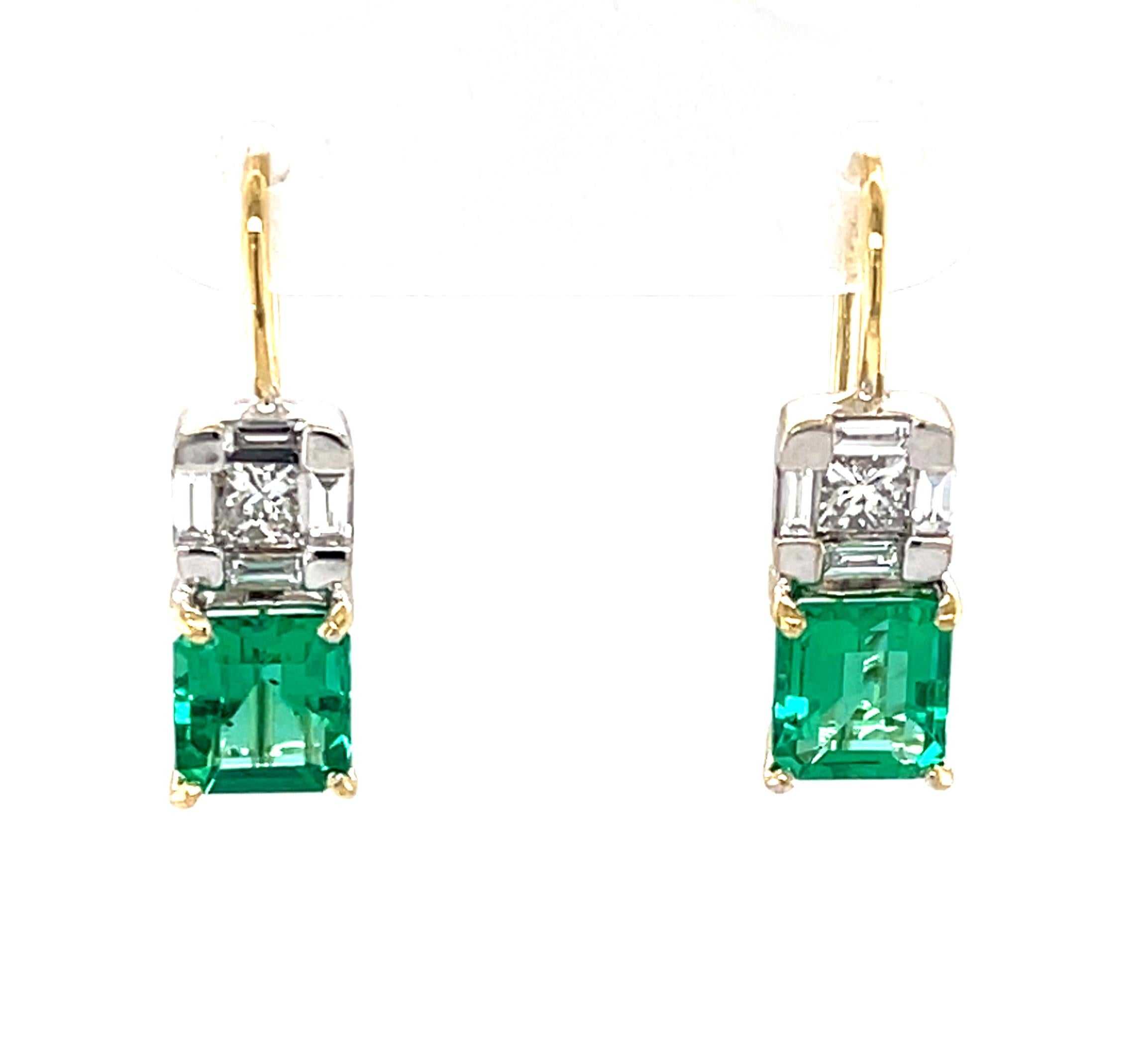 These stunning earrings feature gorgeous emerald-cut emeralds set in 18k yellow gold and topped with an elegant arrangement princess and baguette-cut diamonds. The emeralds have beautifully pure, bright green color, and are remarkably 
