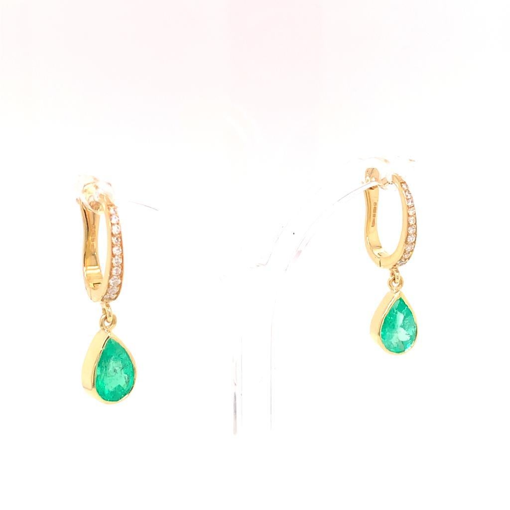 This beautiful pair of drop earrings feature lustrous Emeralds and scintillating round brilliant Diamonds. The Emeralds weigh a total of 3.01 Carats while the Diamonds weigh a total of 0.12 Carats.

Each earring has 10 Diamonds and an alluring