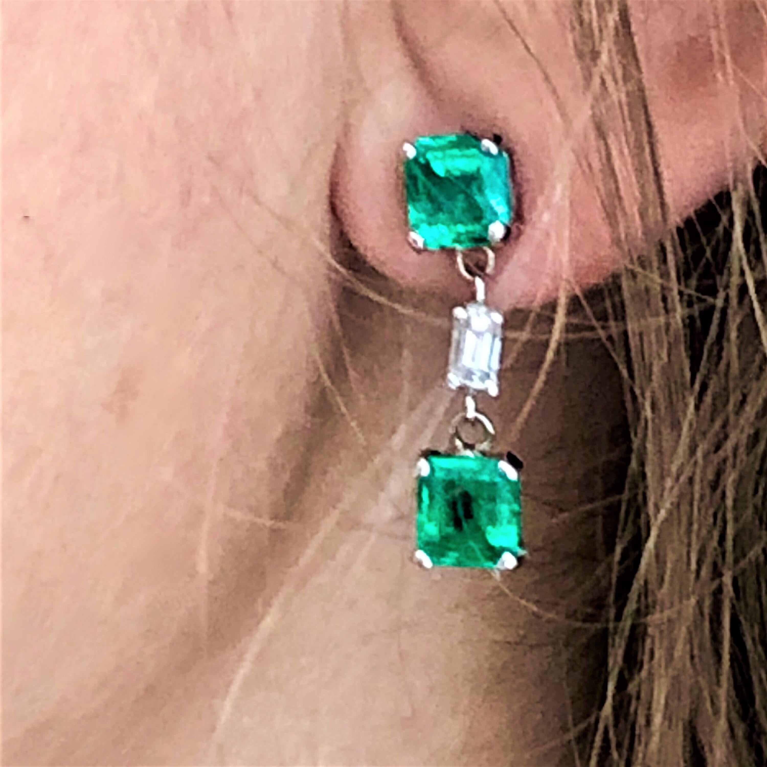 Fourteen karat white gold diamond and emerald drop earrings 
Earrings are one inch long
Two emerald cut diamond weighing 0.30 carat
Four emerald cut emeralds weighing 3.35 carat 
Diamond quality G VS
Emerald quality bright and vivid green
New