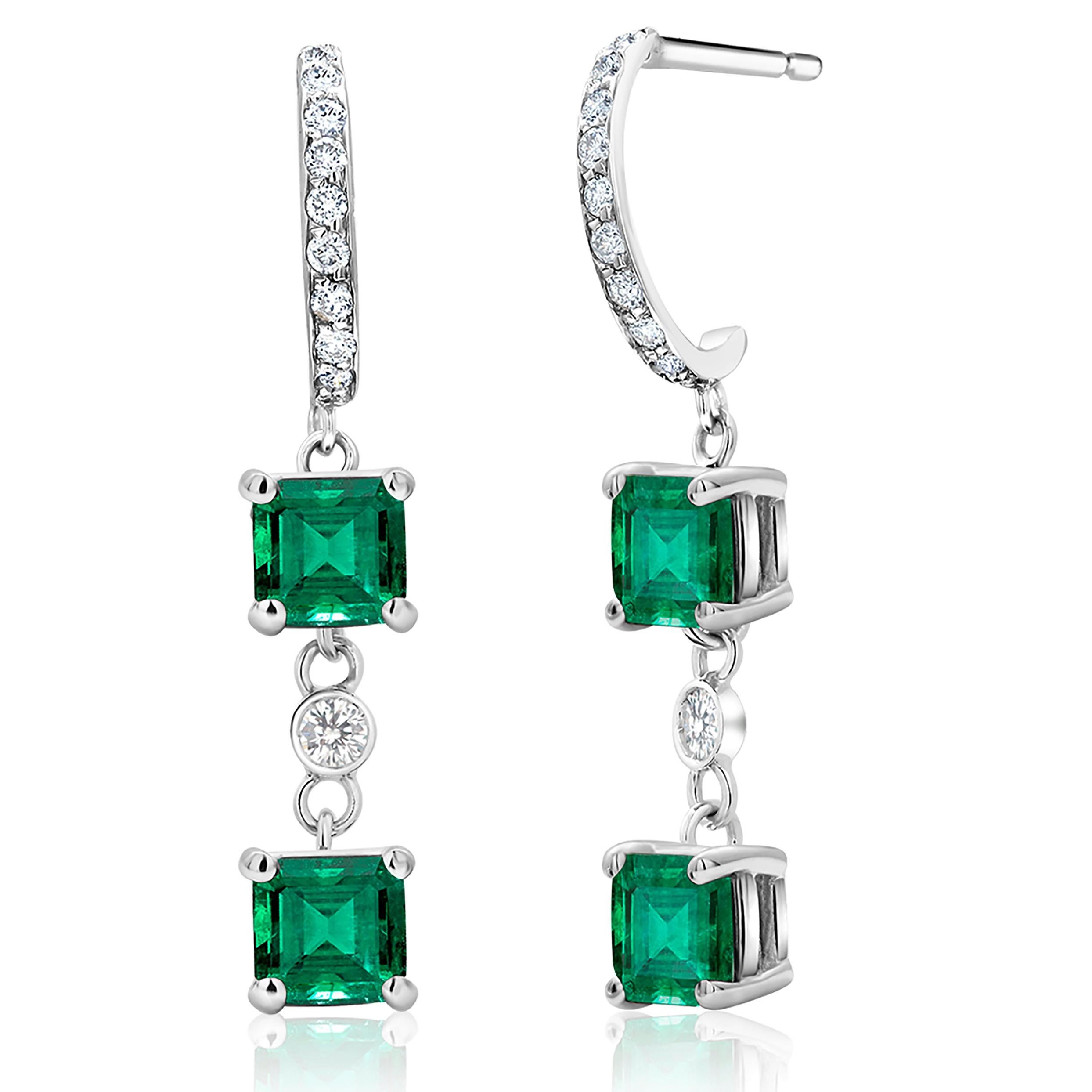 Fourteen karats white gold diamond and emerald drop hoop earrings 
Four Colombian emerald-cut emeralds weighing 2.80 carat
Emeralds measuring 6 millimeters
Diamonds weighing 0.40 carat 
Emeralds quality is bright and vivid green and tone color is