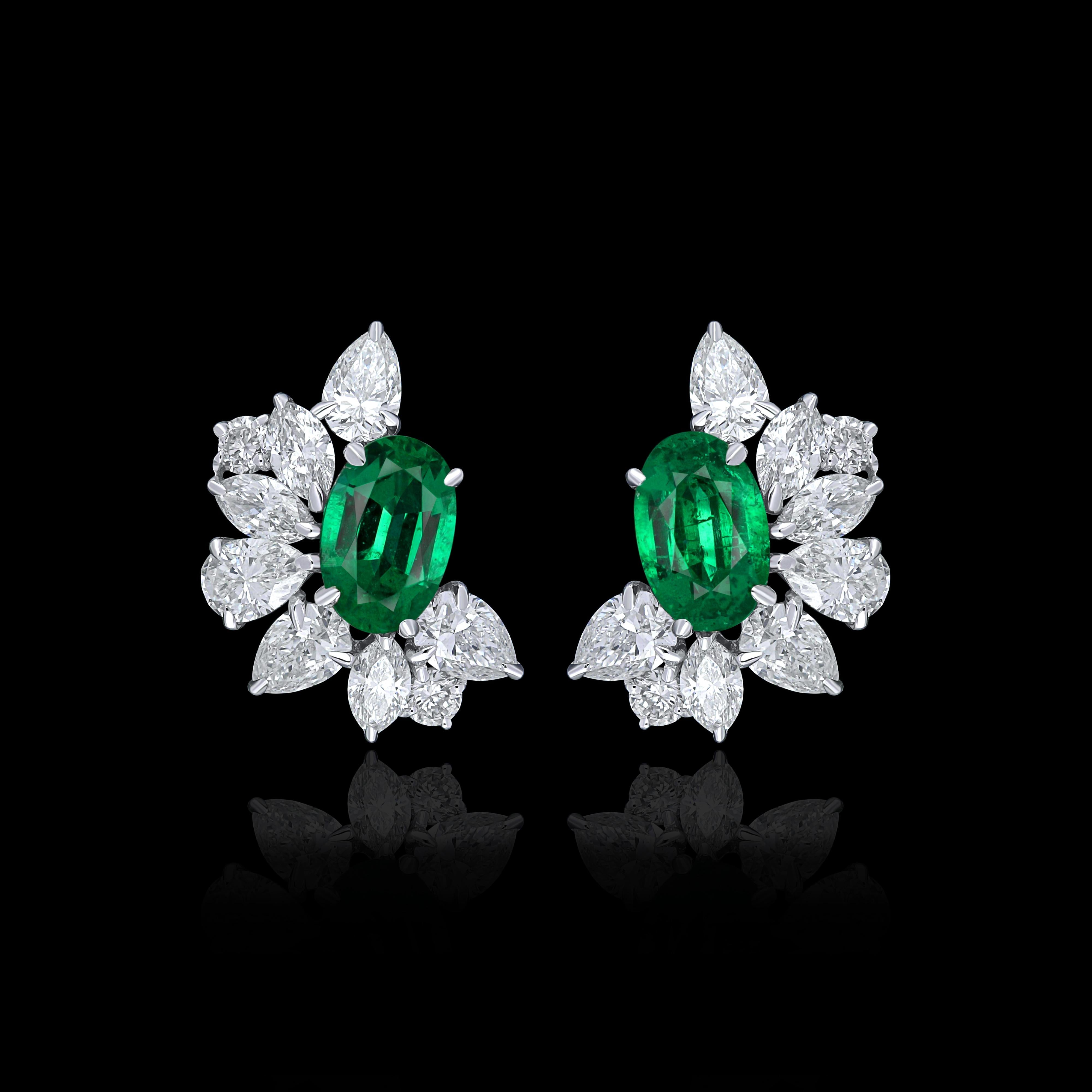 Elegant and exquisitely detailed 18 Karat White Gold Earring, center set with 0.75Cts .Oval Shape Emerald and micro pave set Diamonds, weighing approx. 1.22Cts Beautifully Hand crafted in 18 Karat White Gold.

Stone Detail:
Emerald: 6x4MM

Stone
