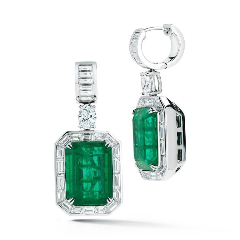 EMERALD AND DIAMOND EARRING Magnificent certified Emeralds are presented alongside a striking halo of baguette cut diamonds Item: # 02342 Metal: 18k W Lab: Gia Color Weight: 42.00 ct. Diamond Weight: 10.66 ct.


