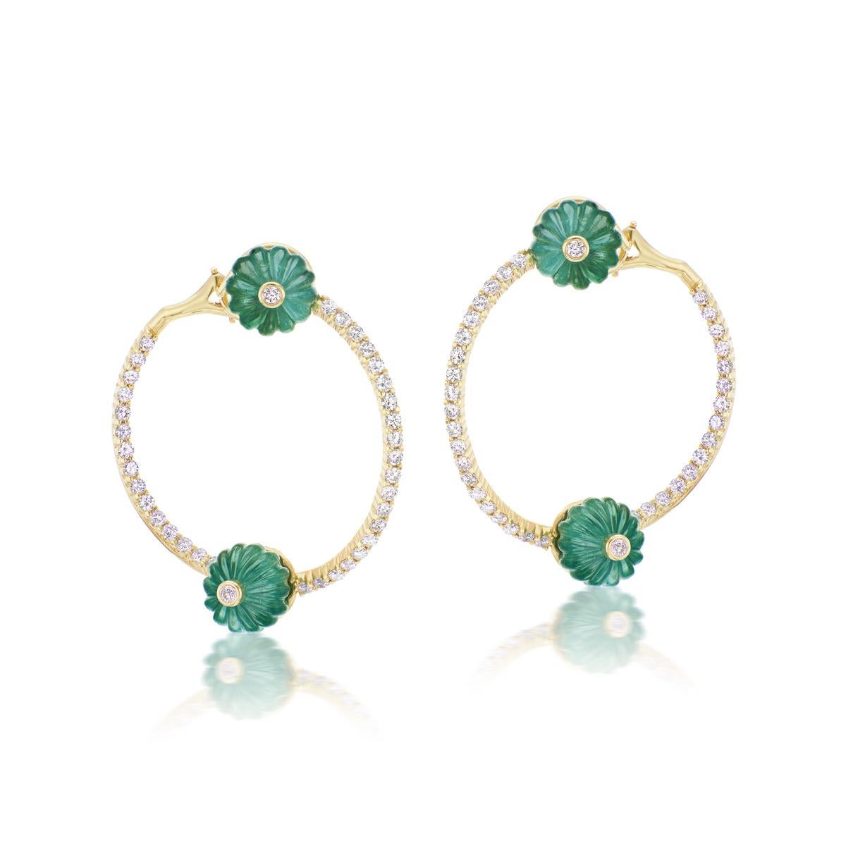 A beautiful pair of Carved Emerald and Diamonds Earrings created as part of a new design collection by Andrew Glassford called the Booster Series. The 21.8 carats of carved Emeralds are set in a hoop with 2.10 carats of Diamonds. The effect is meant