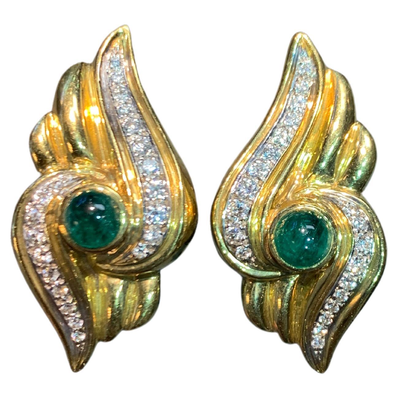 Emerald and Diamond Earrings 

A pair of 18 karat yellow gold earrings set with 2 cabochon emeralds weighing approximately 1.83 carats and approximately 0.91 carats of round cut diamonds

Stamped 750

Measurements: 1.25