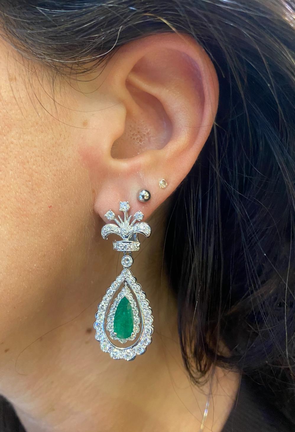 Emerald and Diamond Drop Earrings

White gold earrings set with round cut diamonds and two pear shape emeralds. 

Total Approximate Diamond Weight: 3.10 ct
Total Approximate Emerald Weight: 2.52 ct 
Approximate Length: 1.75