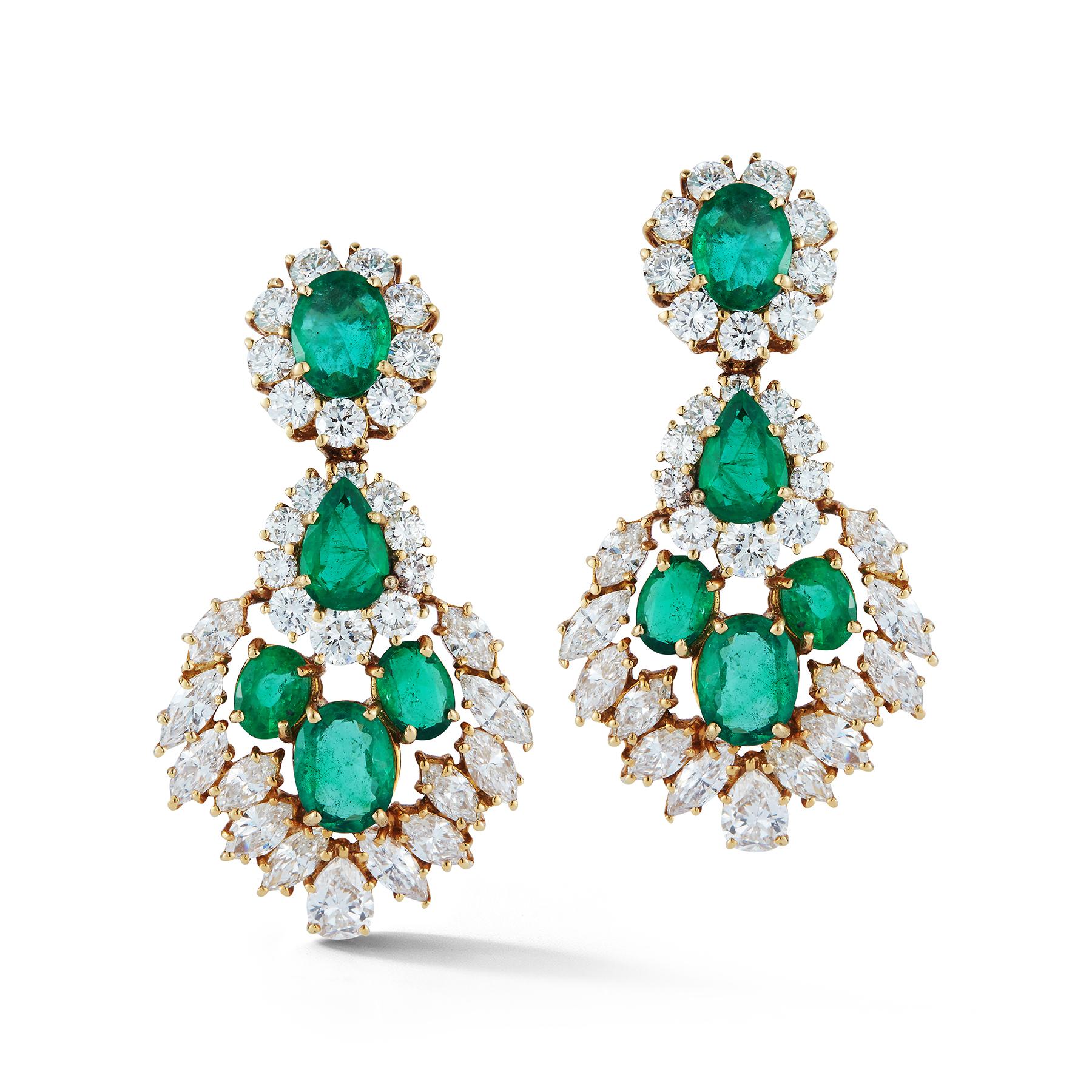 Emerald and Diamond Earrings

8 oval emeralds and 2 Pear shape emeralds app 12.80 ct 
38 round diamonds app 5.27 ct and 24 marquee diamond app 5.47 ct

Made Circa 1960

14 Karat Yellow Gold
